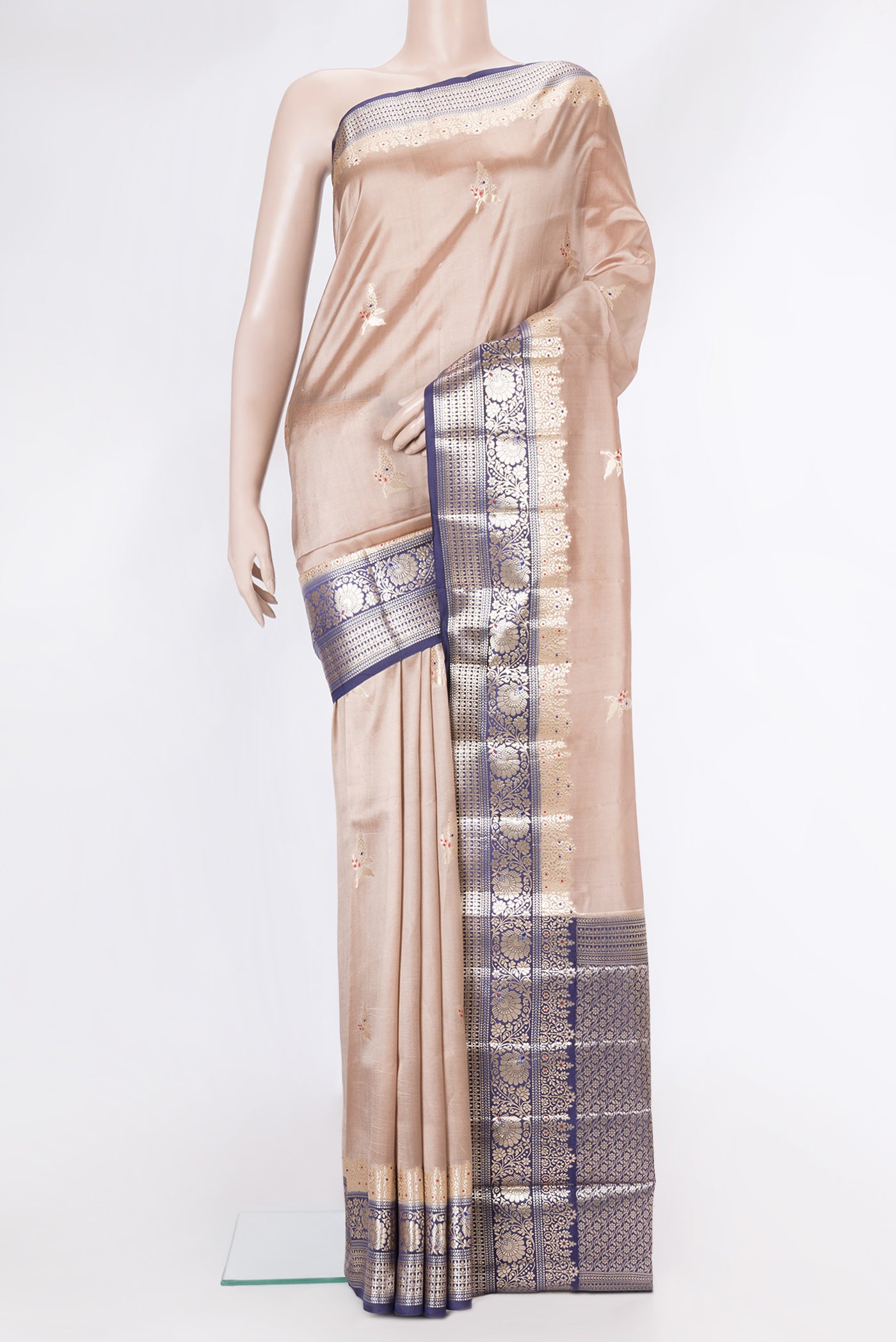 Beige Dual Tone Tussar Silk Saree with Zari Butta on the body and Fancy Border.  displayed on a mannequin