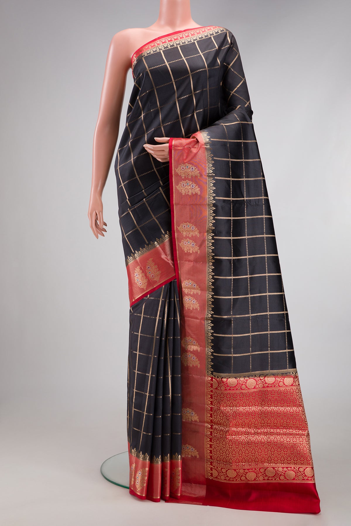 Black Dual Tone Tussar Silk Saree with Checked design on the body and Zari Border.  displayed on a mannequin