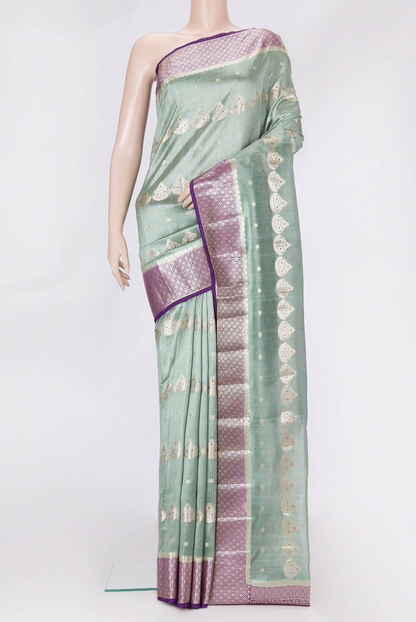 Sea Green Dual Tone Tussar Silk Saree with Zari And Thread Butta on the body and Zari Border.  displayed on a mannequin
