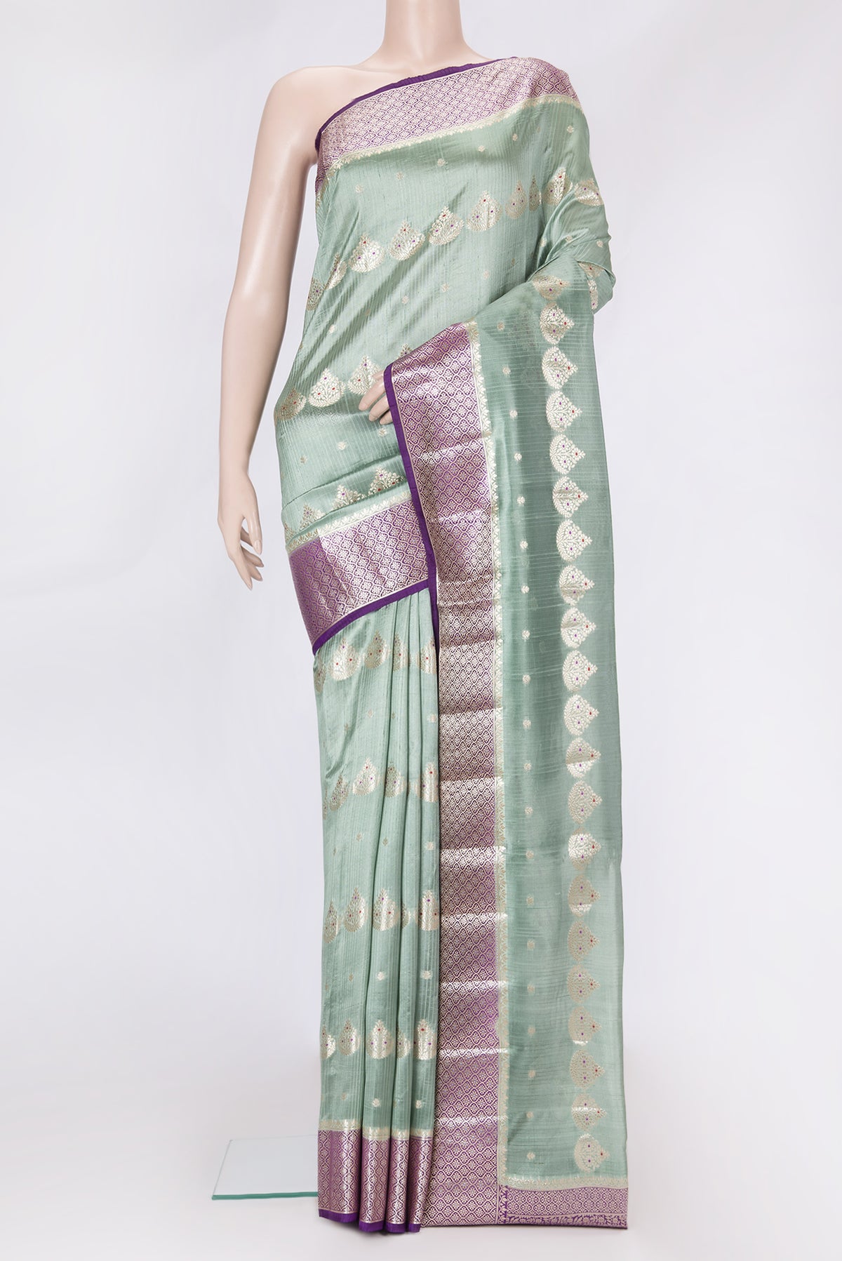 Sea Green Dual Tone Tussar Silk Saree with Zari And Thread Butta on the body and Zari Border.  displayed on a mannequin