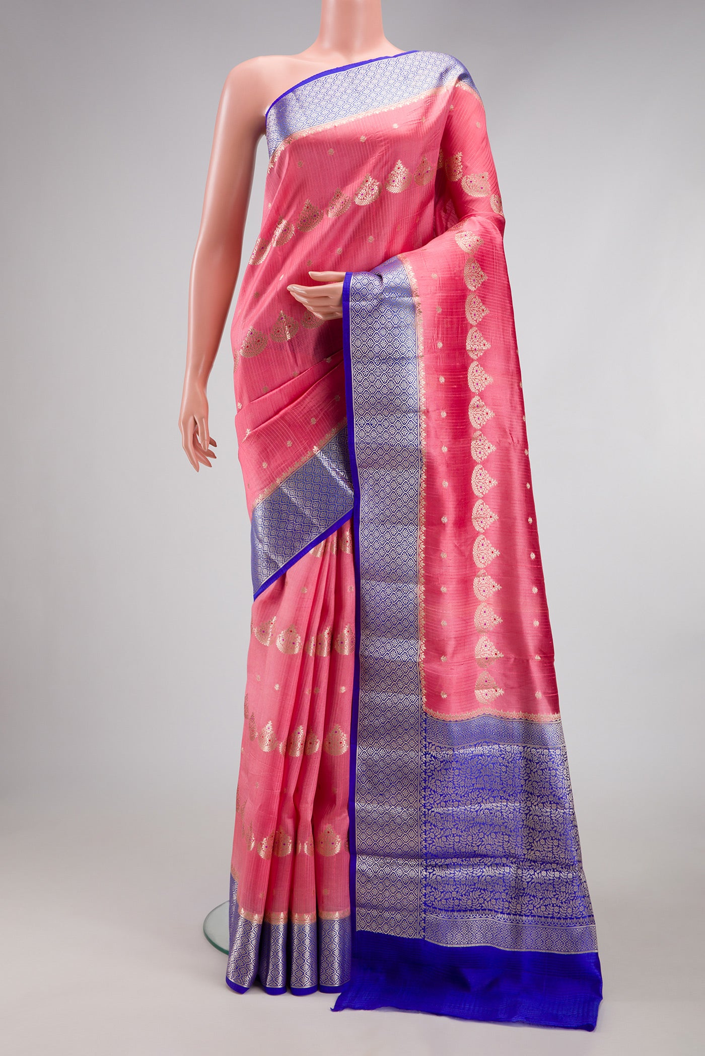 Pink Dual Tone Tussar Silk Saree with Zari Butta on the body and Fancy Border.  displayed on a mannequin