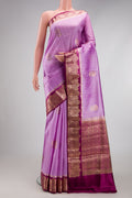 Lavender Dual Tone Tussar Silk Saree with Zari And Thread Butta on the body and Zari Border.  displayed on a mannequin