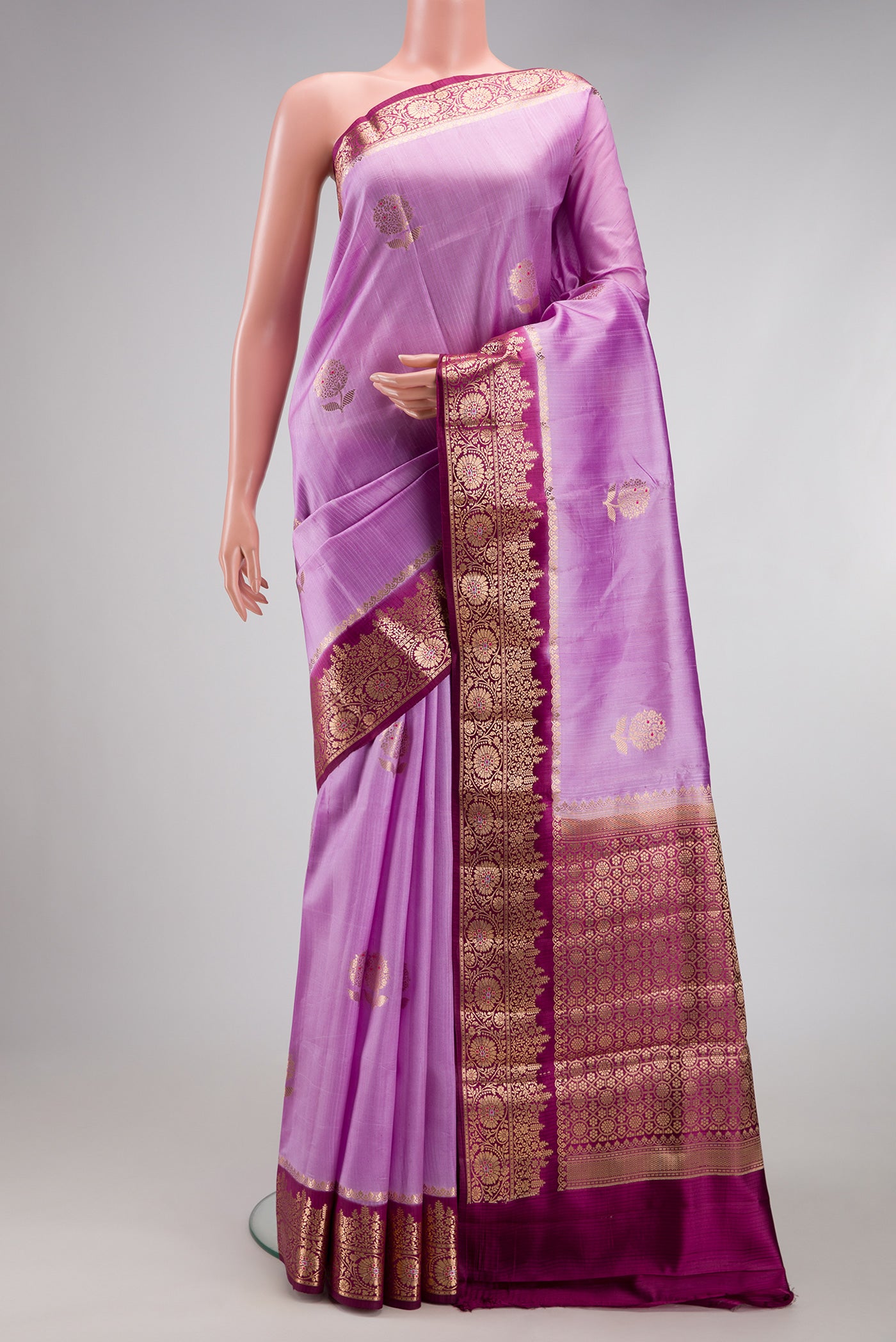 Lavender Dual Tone Tussar Silk Saree with Zari And Thread Butta on the body and Zari Border.  displayed on a mannequin