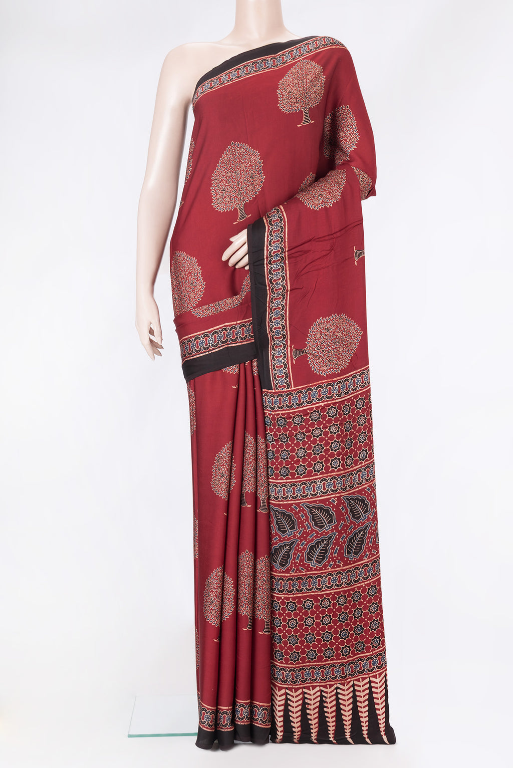 Maroon Dual Tone Blended Crepe Saree with Ajrakh Print on the body and Fancy Border.  displayed on a mannequin