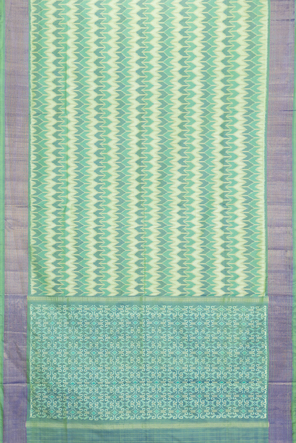 Flat view of Green Dual Tone Double Ikat Saree with Ikat Print on the body and Zari Border. 