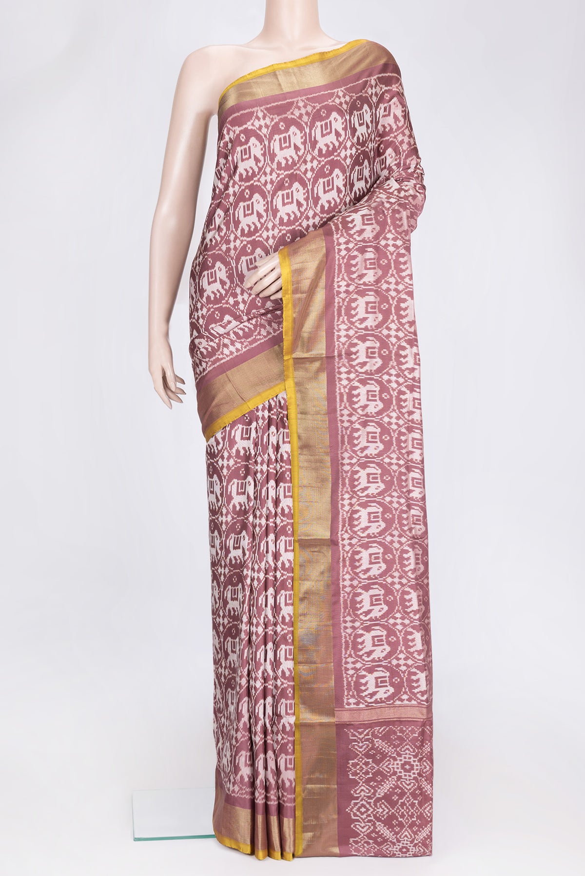 Brown Dual Tone Double Ikat Saree with Ikat Print on the body and Zari Border.  displayed on a mannequin