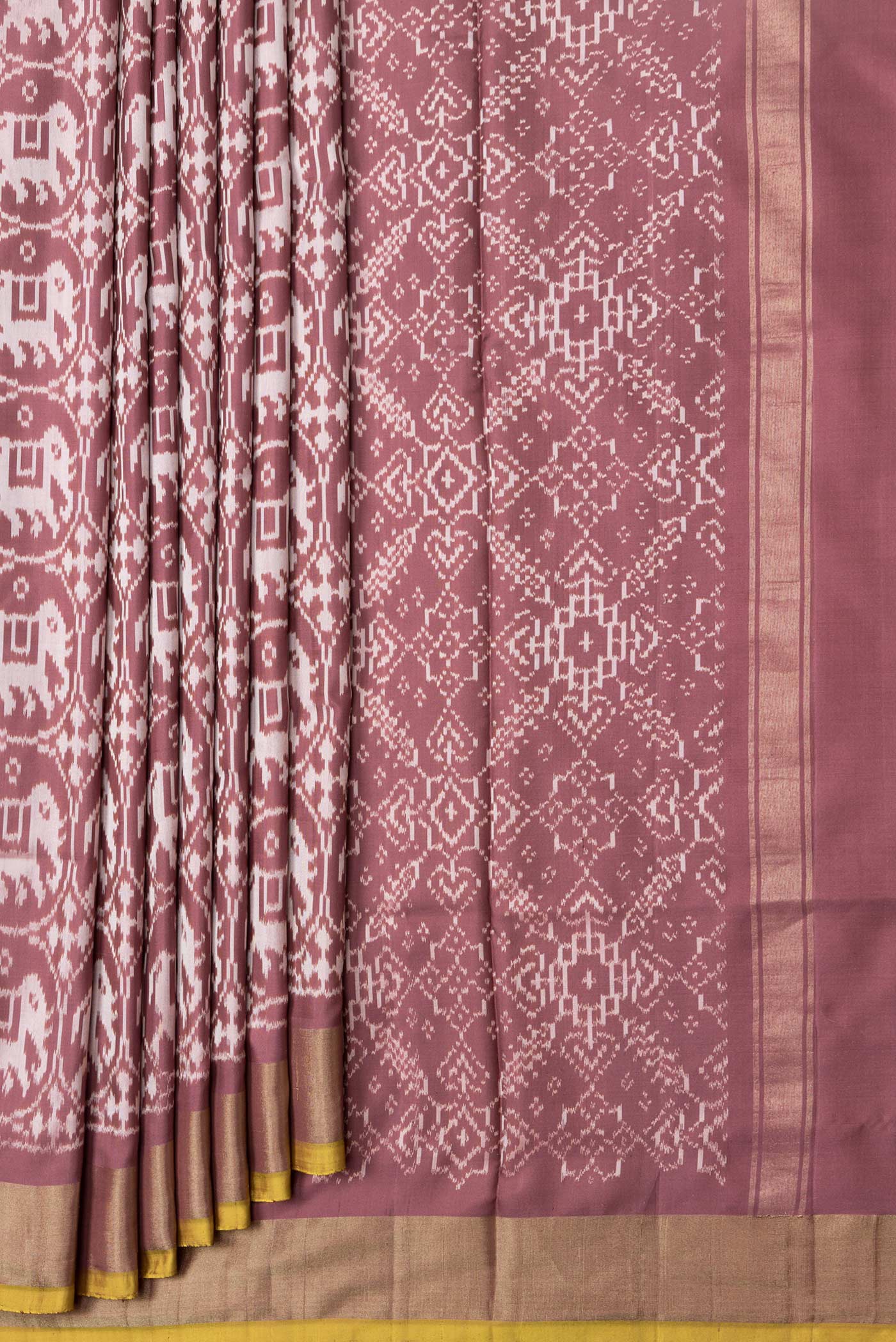 Pleats and pallu of Brown Dual Tone Double Ikat Saree with Ikat Print on the body and Zari Border. 