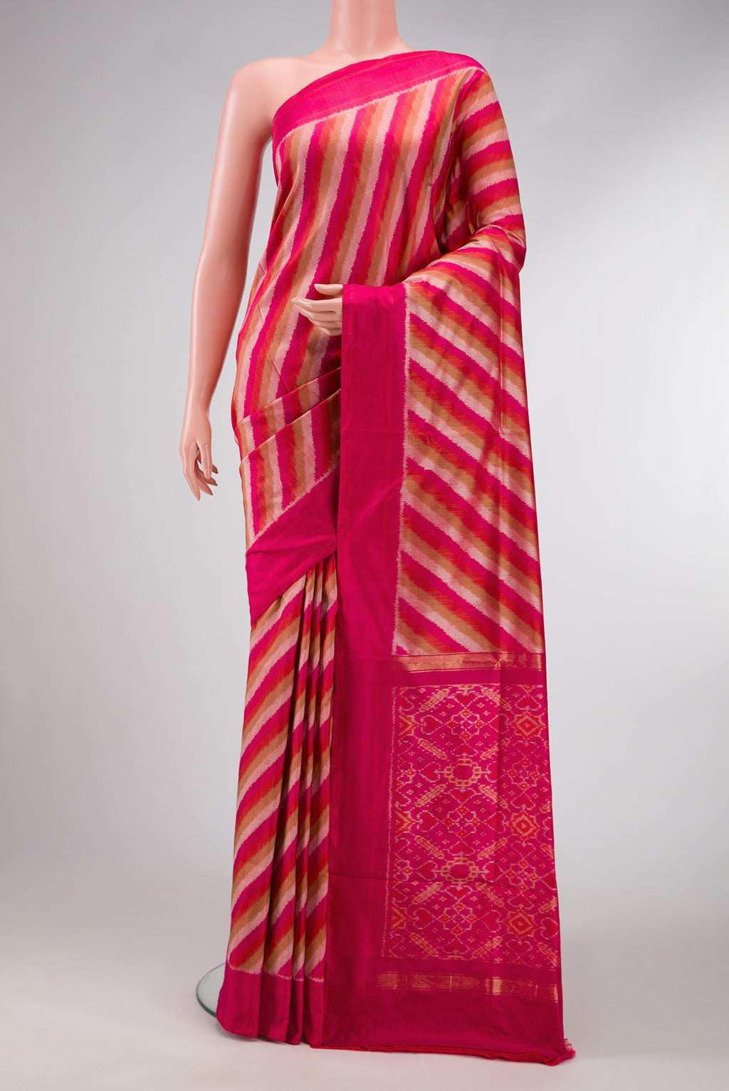 Pink Dual Tone Double Ikat Saree with Ikat Print on the body and Plain Border.  displayed on a mannequin