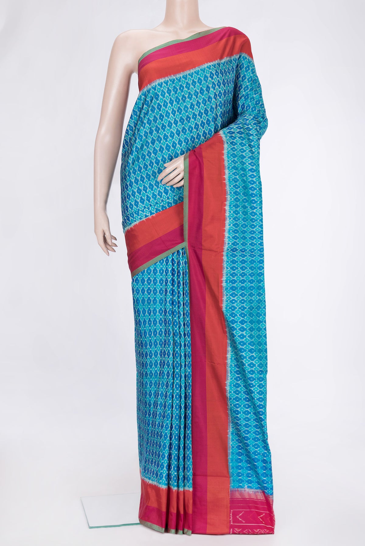 Sky Blue Dual Tone Double Ikat Saree with Ikat Print on the body and Plain Border.  displayed on a mannequin