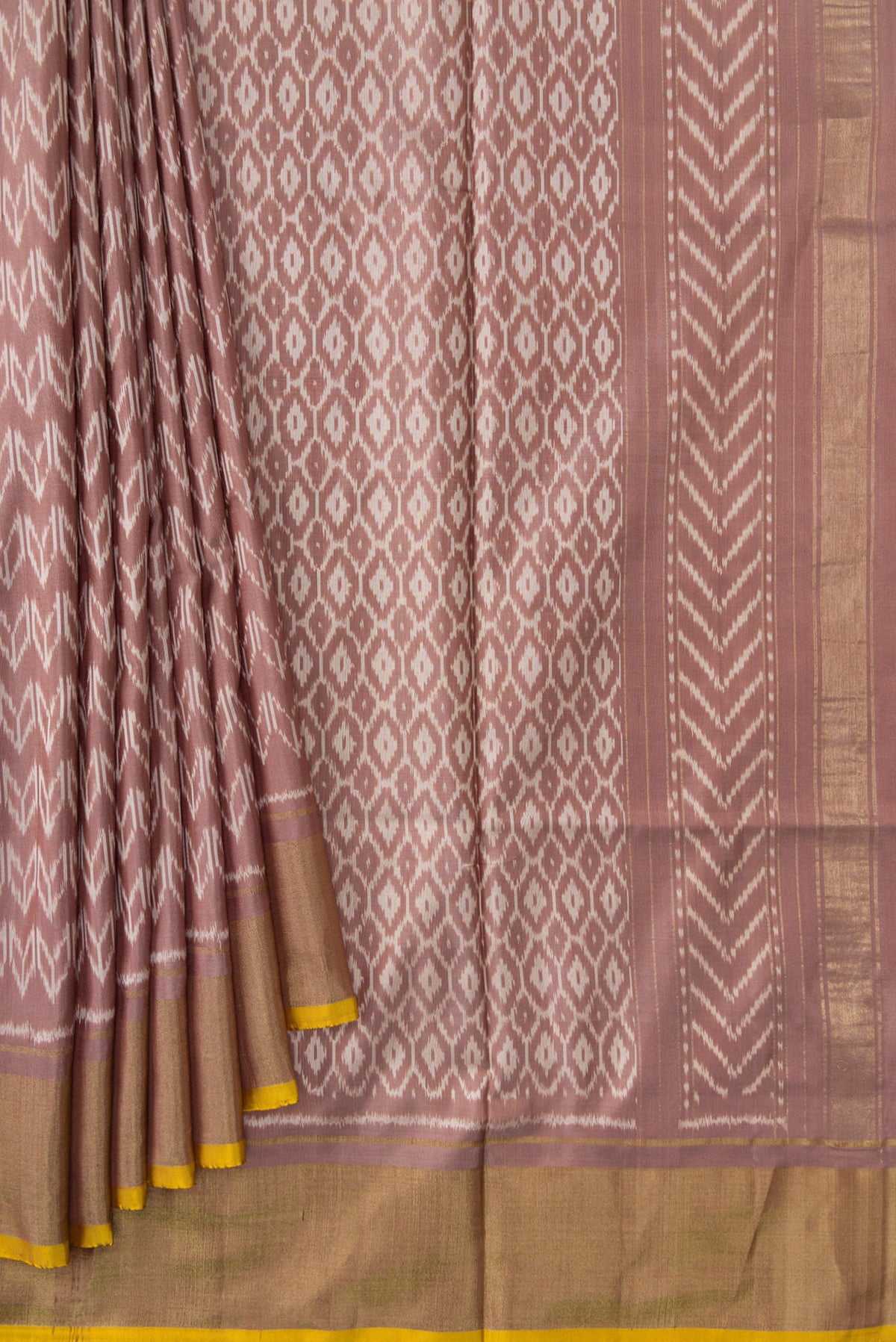 Pleats and pallu of Brown Dual Tone Double Ikat Saree with Ikat Print on the body and Zari Border. 