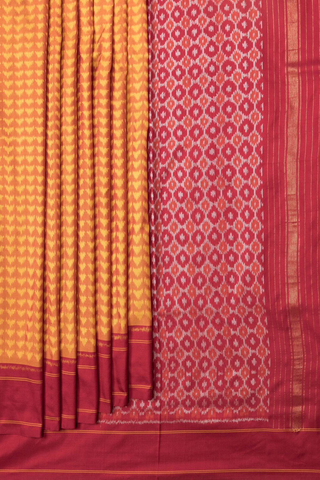 Pleats and pallu of Mustard Dual Tone Double Ikat Saree with Ikat Print on the body and Plain Border. 