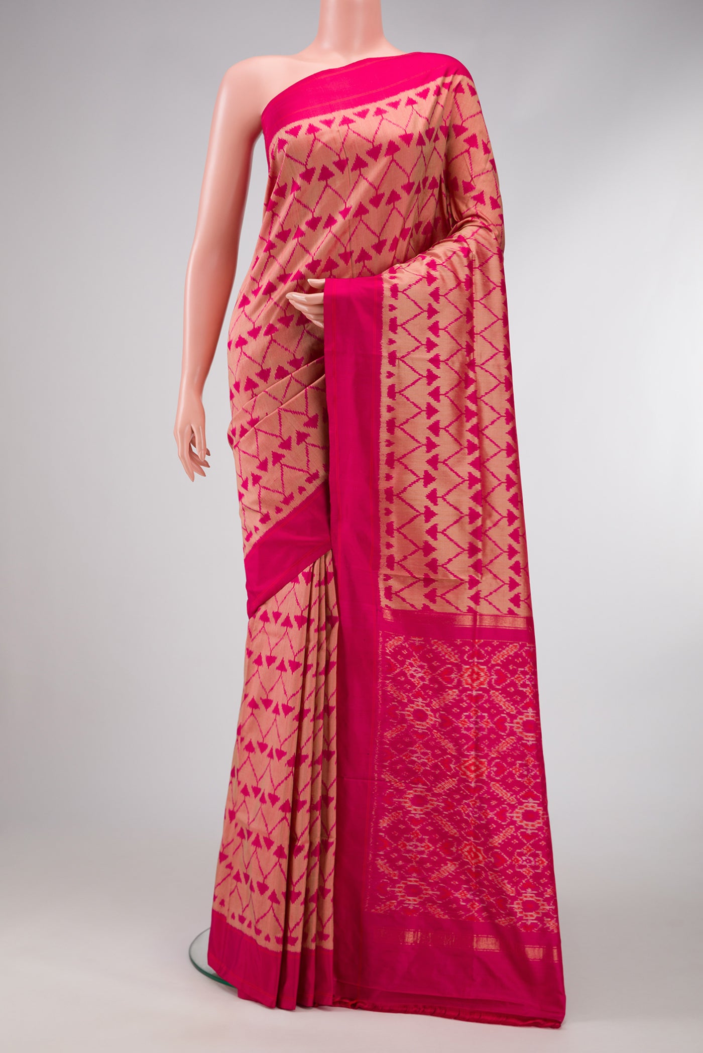 Pink Dual Tone Double Ikat Saree with Ikat Print on the body and Plain Border.  displayed on a mannequin