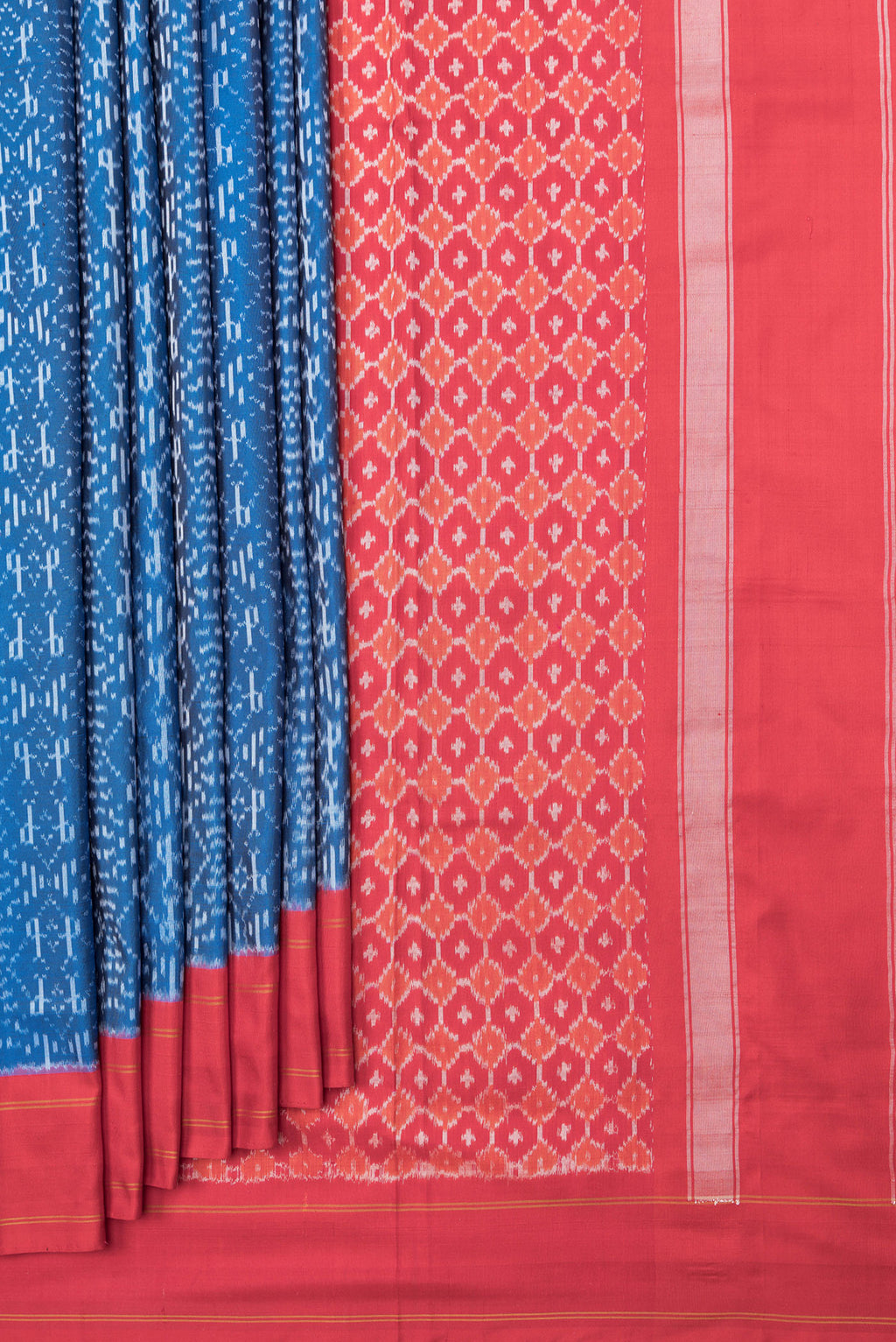 Pleats and pallu of Peacock Blue Dual Tone Double Ikat Saree with Ikat Print on the body and Plain Border. 