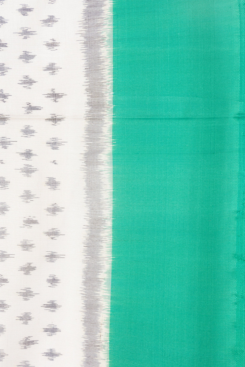 Border image of Off White Dual Tone Double Ikat Saree with Ikat Print on the body and Plain Border. 