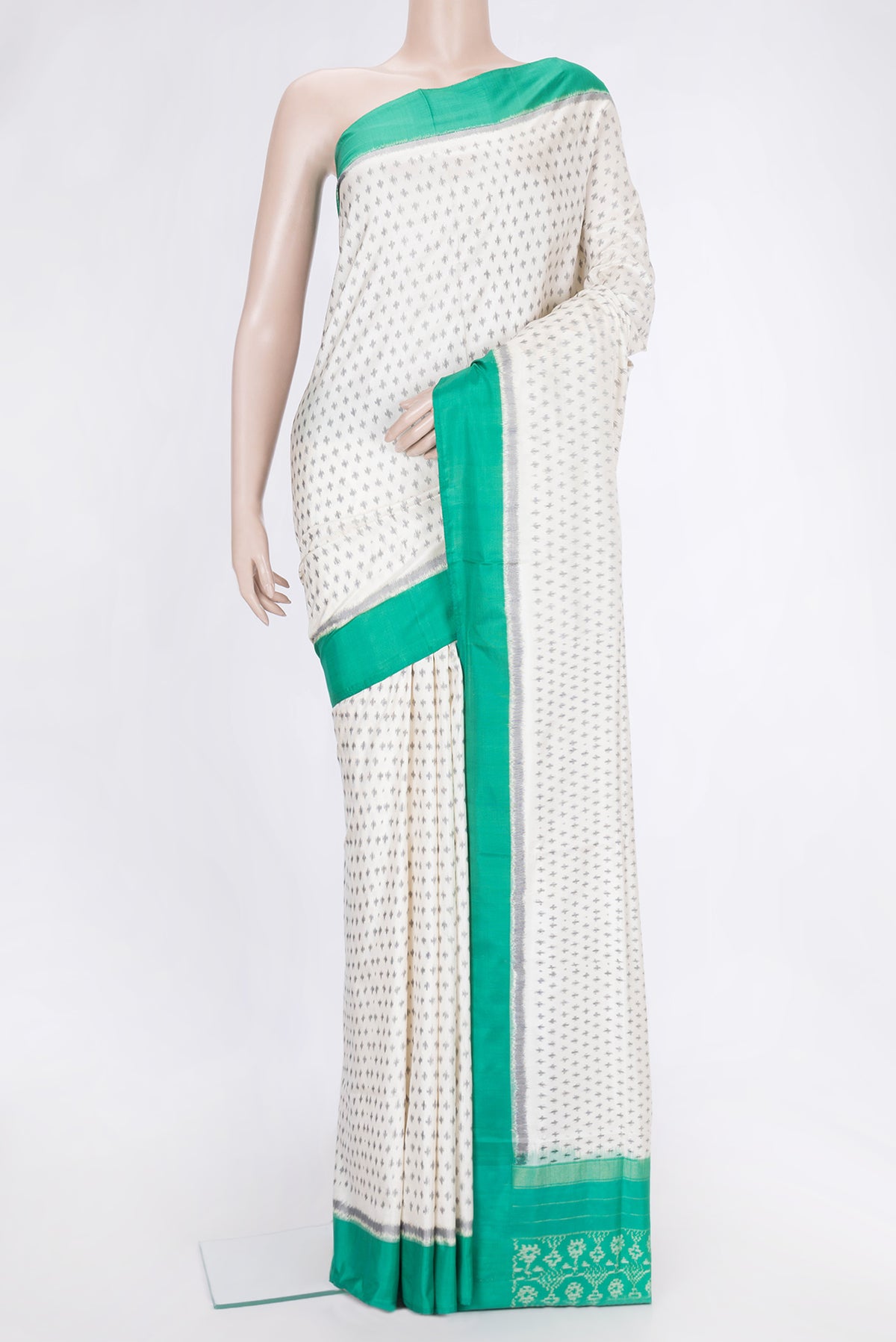 Off White Dual Tone Double Ikat Saree with Ikat Print on the body and Plain Border.  displayed on a mannequin