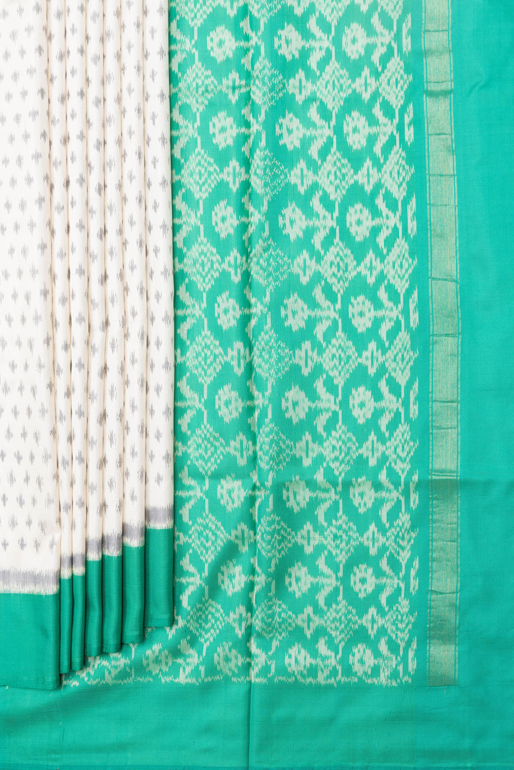 Pleats and pallu of Off White Dual Tone Double Ikat Saree with Ikat Print on the body and Plain Border. 