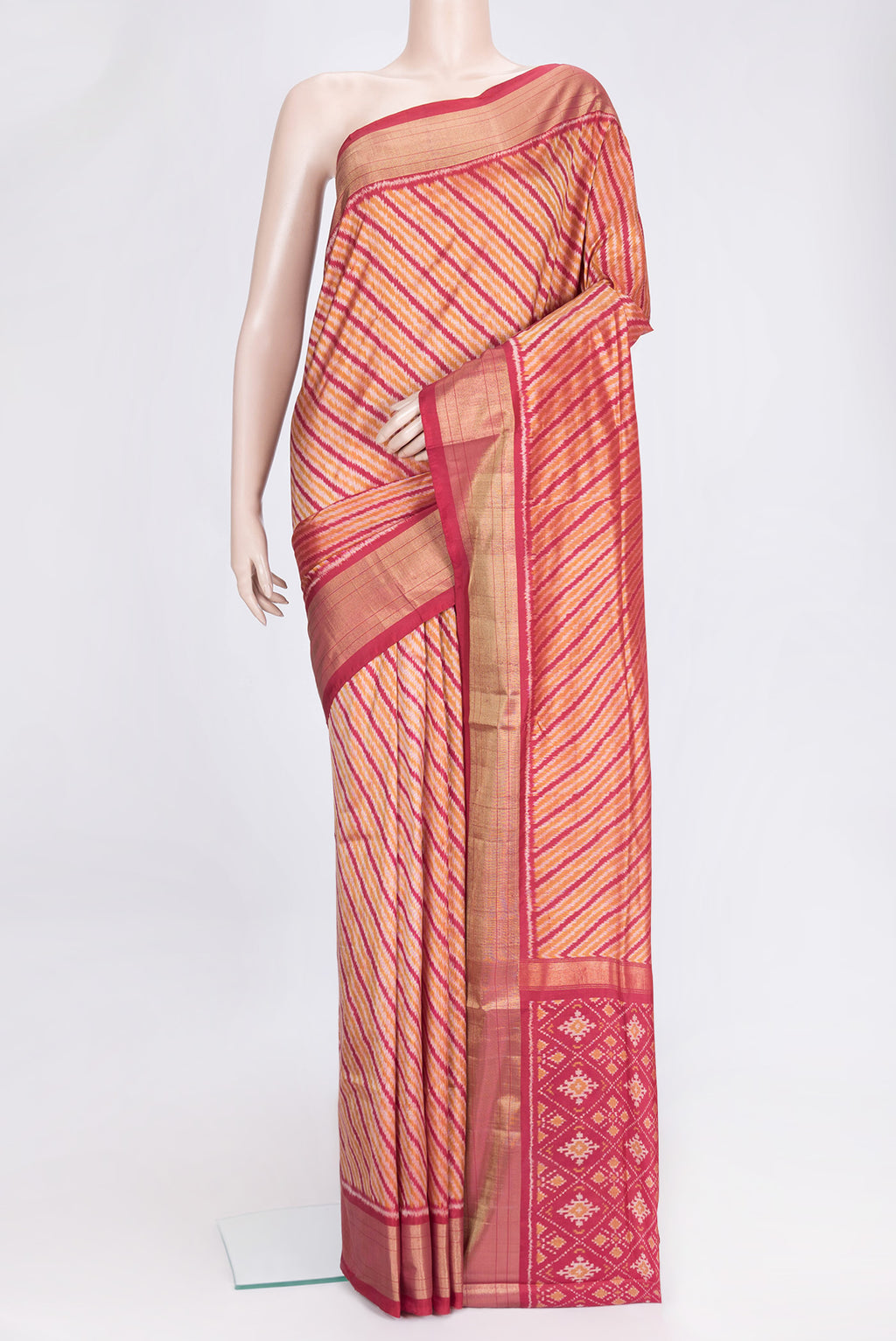 Maroon Dual Tone Double Ikat Saree with Ikat Print on the body and Plain Border.  displayed on a mannequin