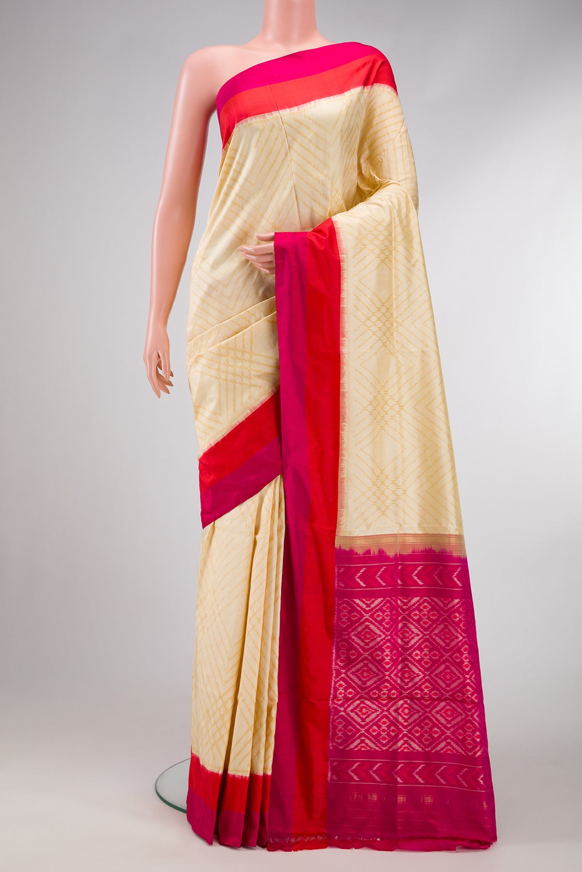 Sandal Dual Tone Double Ikat Saree with Ikat Print on the body and Plain Border.  displayed on a mannequin
