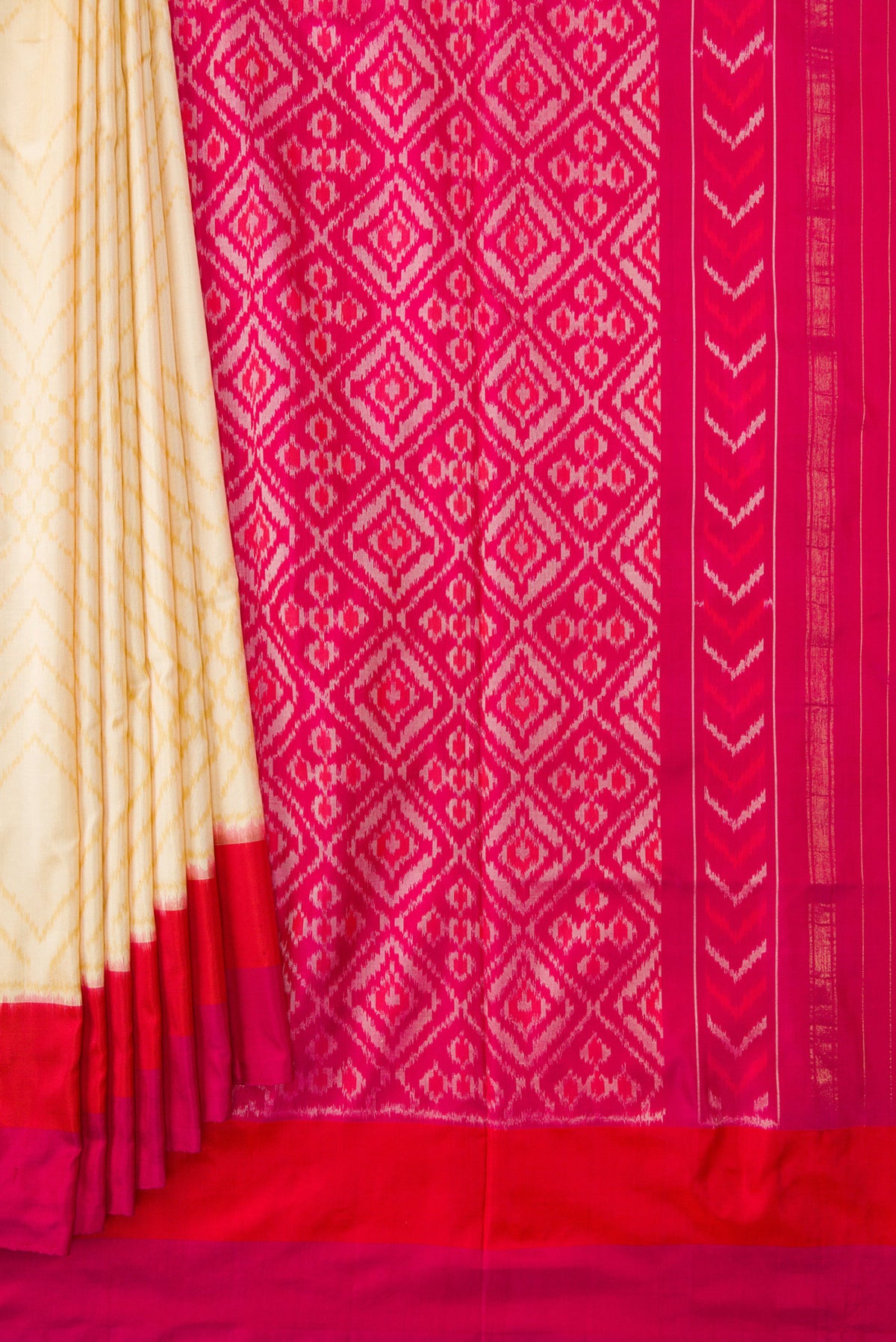 Pleats and pallu of Sandal Dual Tone Double Ikat Saree with Ikat Print on the body and Plain Border. 