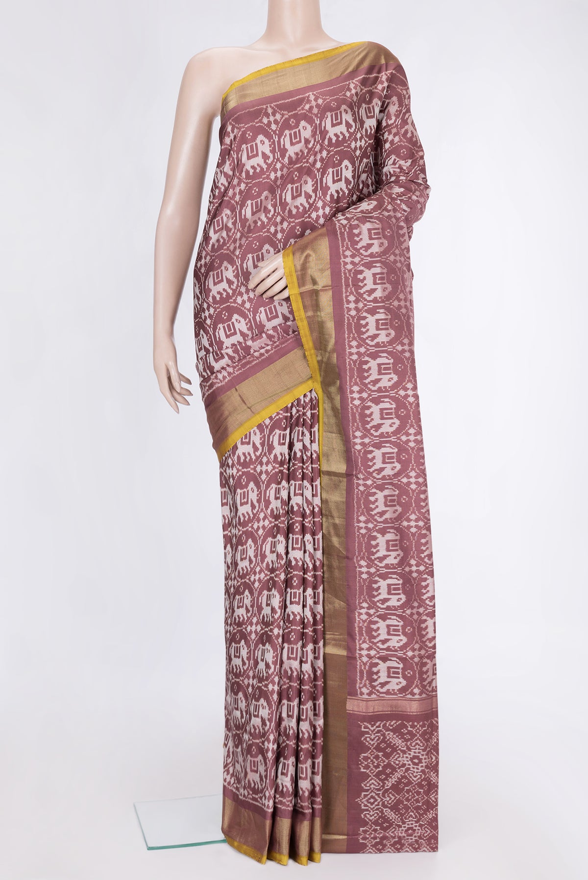Brown Dual Tone Double Ikat Saree with Ikat Print on the body and Zari Border.  displayed on a mannequin