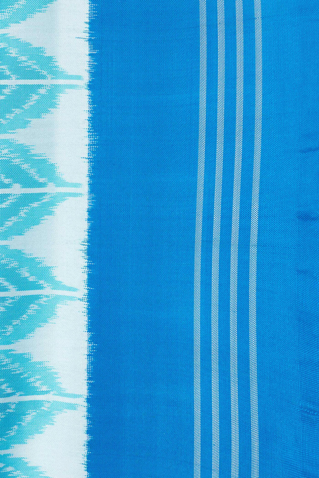 Border image of Sky Blue Dual Tone Double Ikat Saree with Ikat Print on the body and Plain Border. 