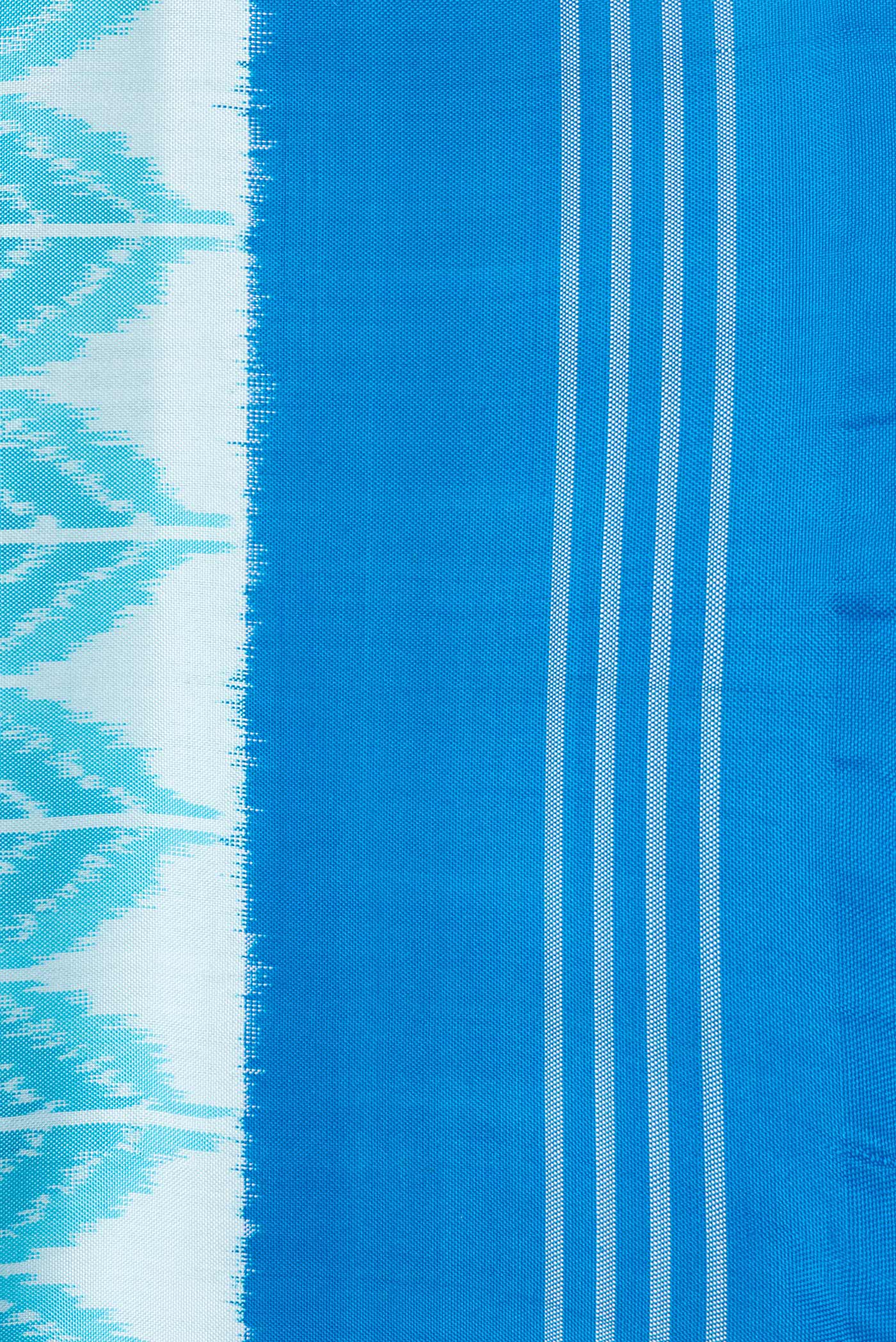 Border image of Sky Blue Dual Tone Double Ikat Saree with Ikat Print on the body and Plain Border. 