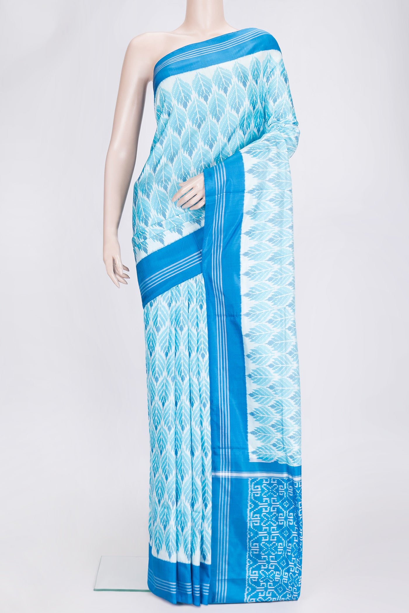 Sky Blue Dual Tone Double Ikat Saree with Ikat Print on the body and Plain Border.  displayed on a mannequin