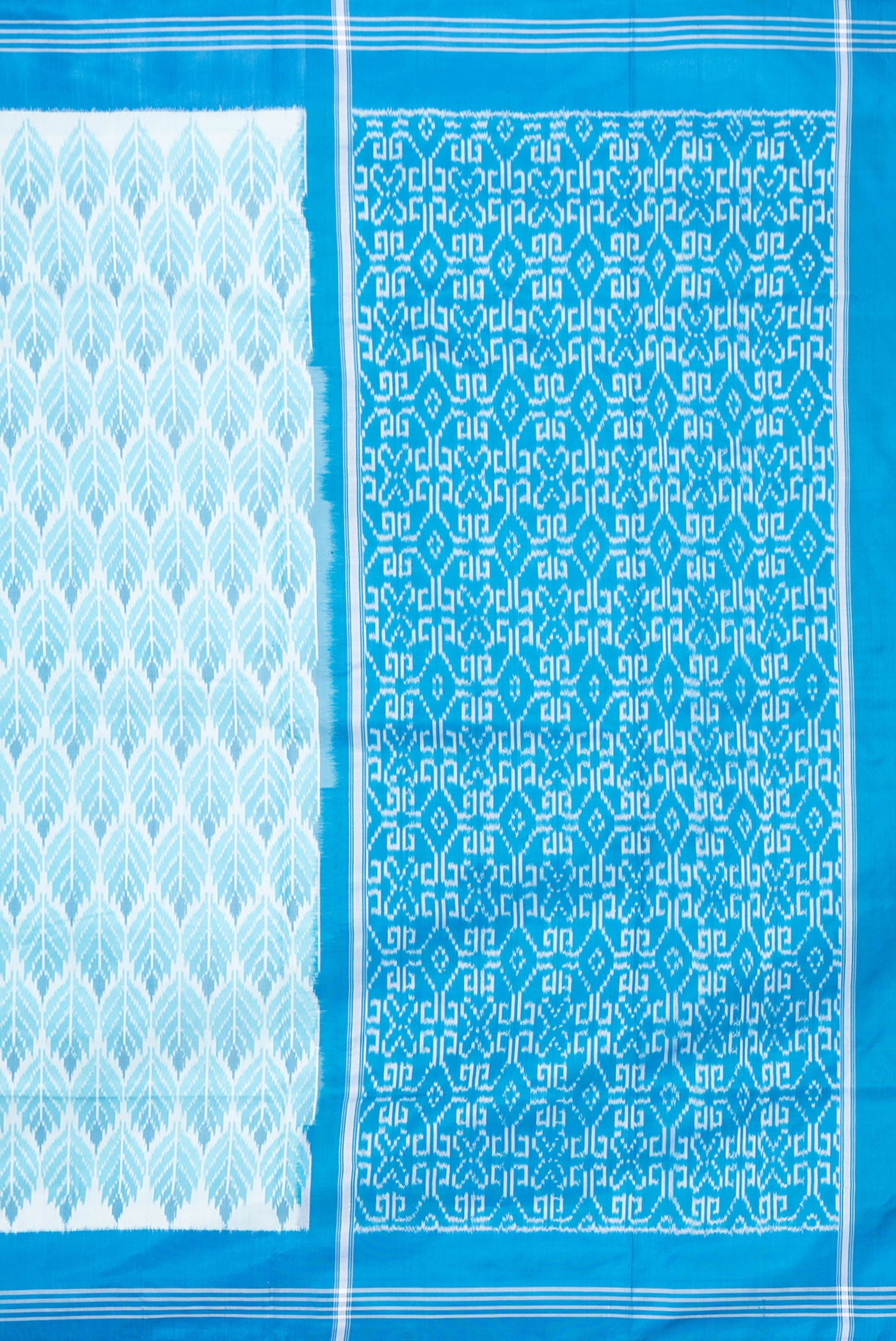 Close up image of the pallu of Sky Blue Dual Tone Double Ikat Saree with Ikat Print on the body and Plain Border. 