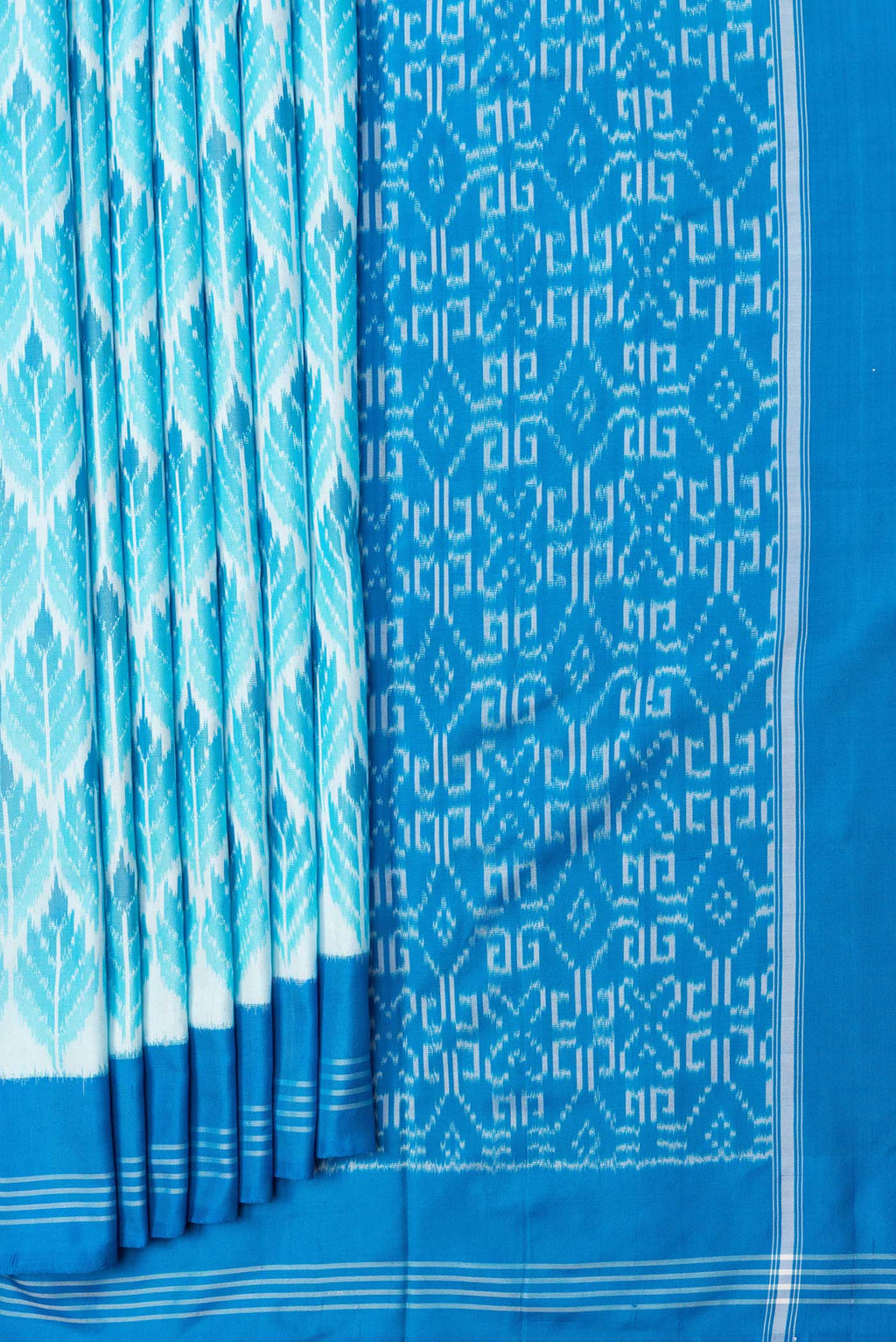 Pleats and pallu of Sky Blue Dual Tone Double Ikat Saree with Ikat Print on the body and Plain Border. 