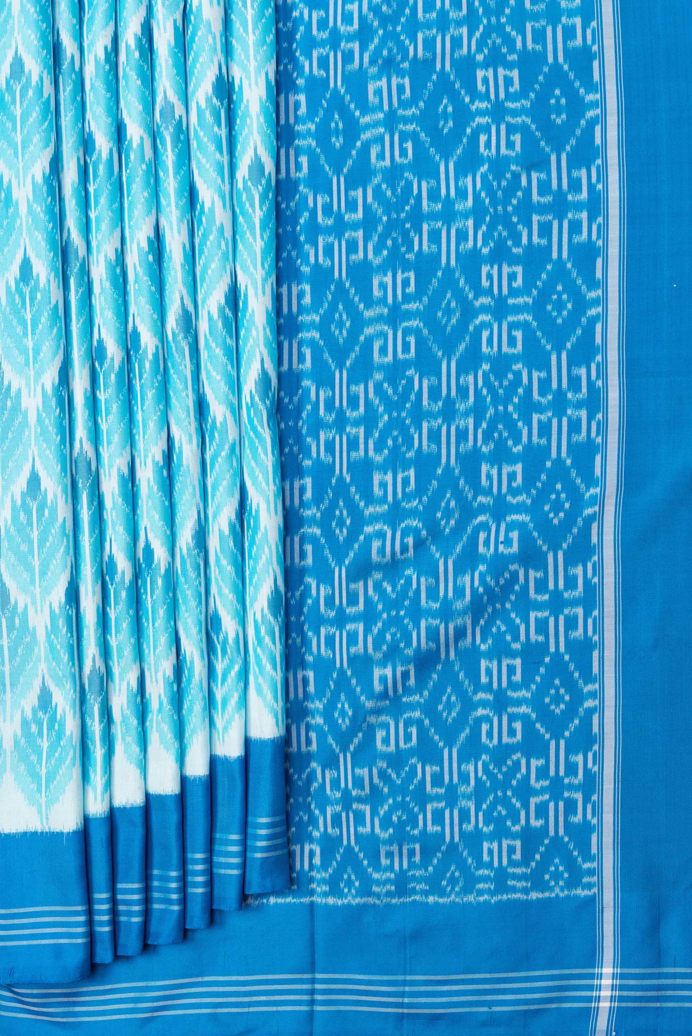 Pleats and pallu of Sky Blue Dual Tone Double Ikat Saree with Ikat Print on the body and Plain Border. 