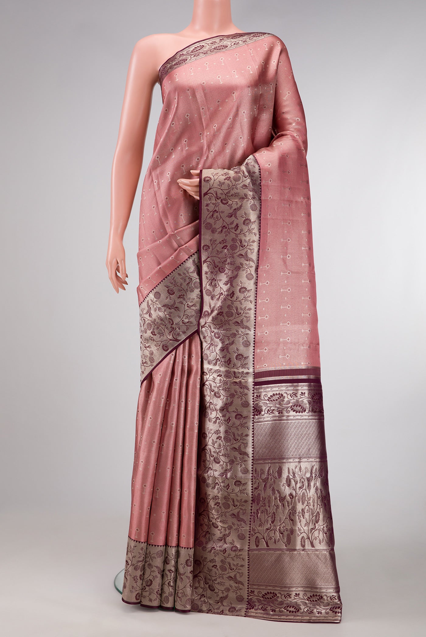Pink Dual Tone Kanjivaram Tissue Silk Saree with Zari Brocade on the body and Zari Border.  displayed on a mannequin