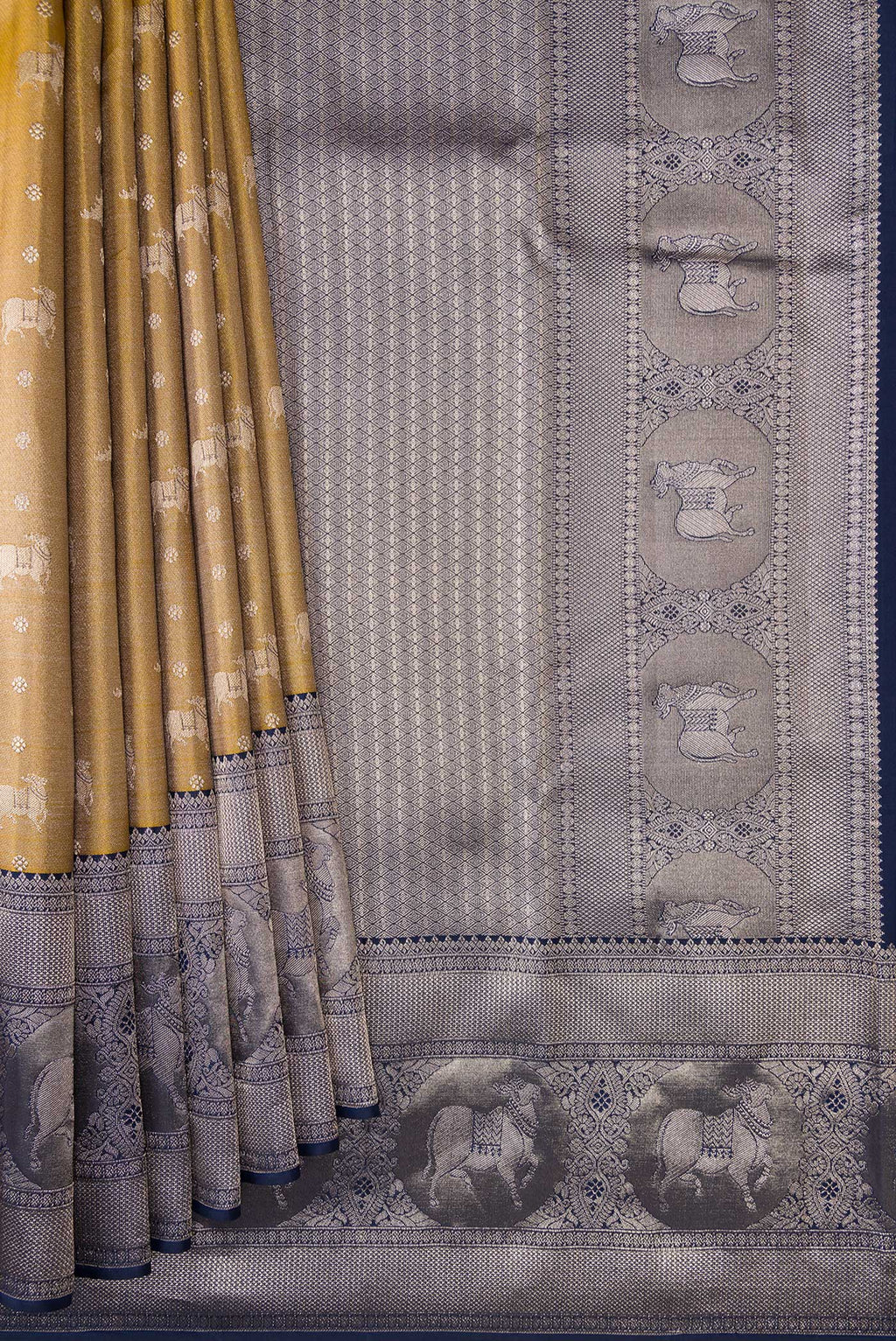 Pleats and pallu of Gold Dual Tone Kanjivaram Tissue Silk Saree with Zari Brocade on the body and Fancy Border. 