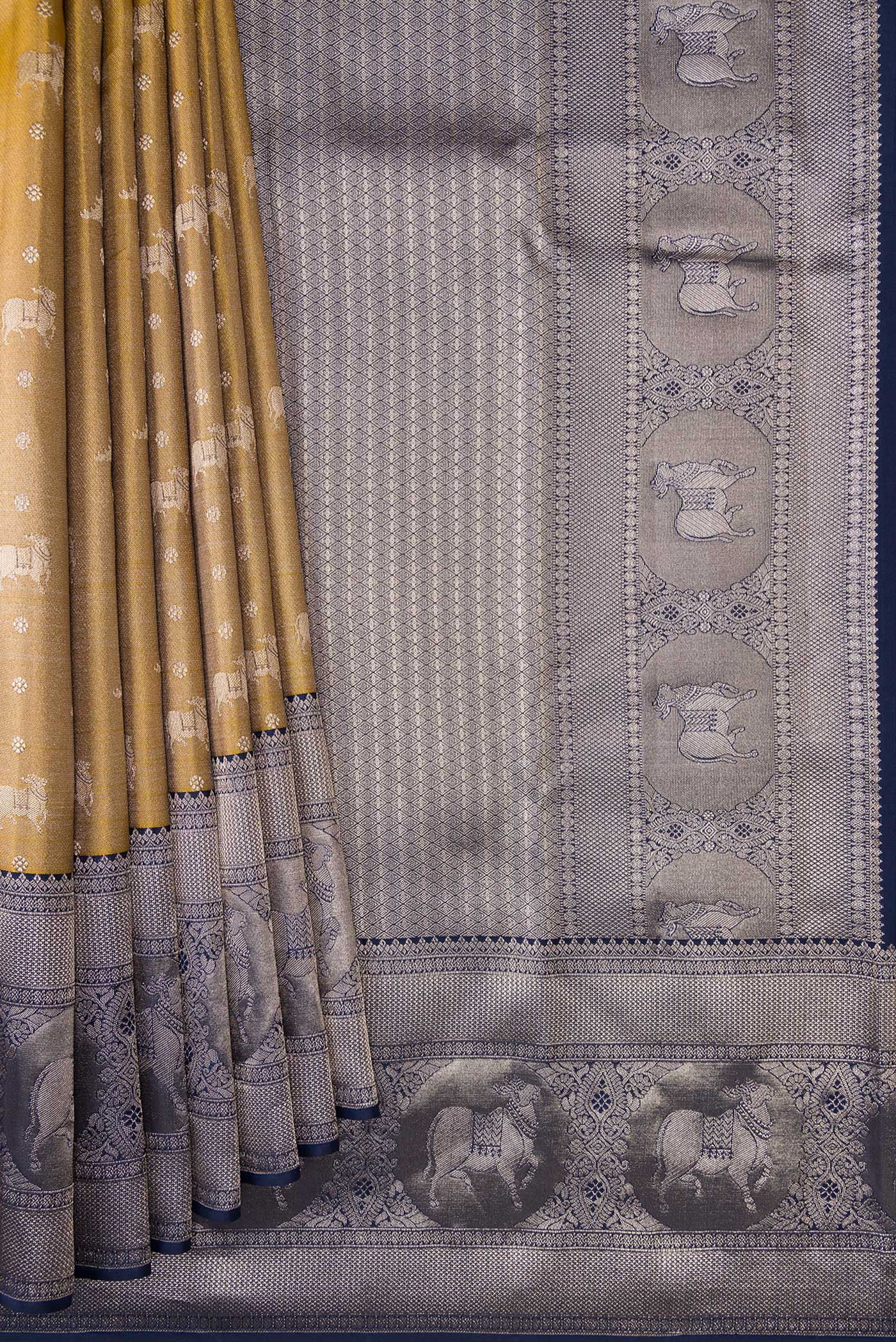 Pleats and pallu of Gold Dual Tone Kanjivaram Tissue Silk Saree with Zari Brocade on the body and Fancy Border. 