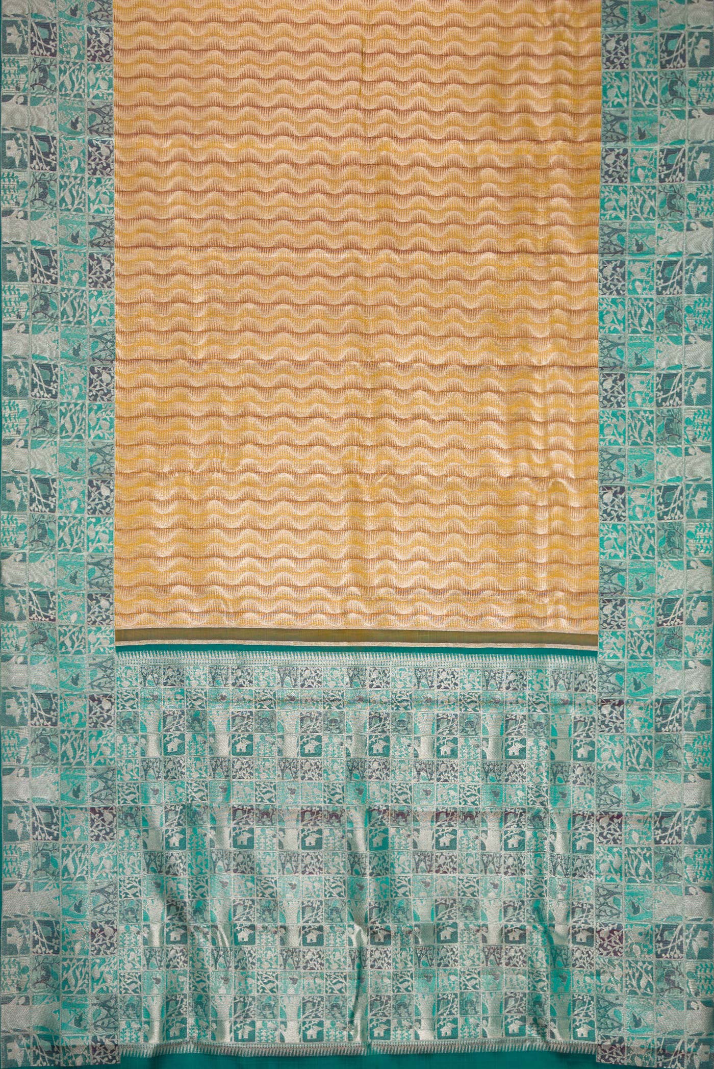 Flat view of Mehandi Green Dual Tone Kanjivaram Tissue Silk Saree with Zari Brocade on the body and Zari Border. 
