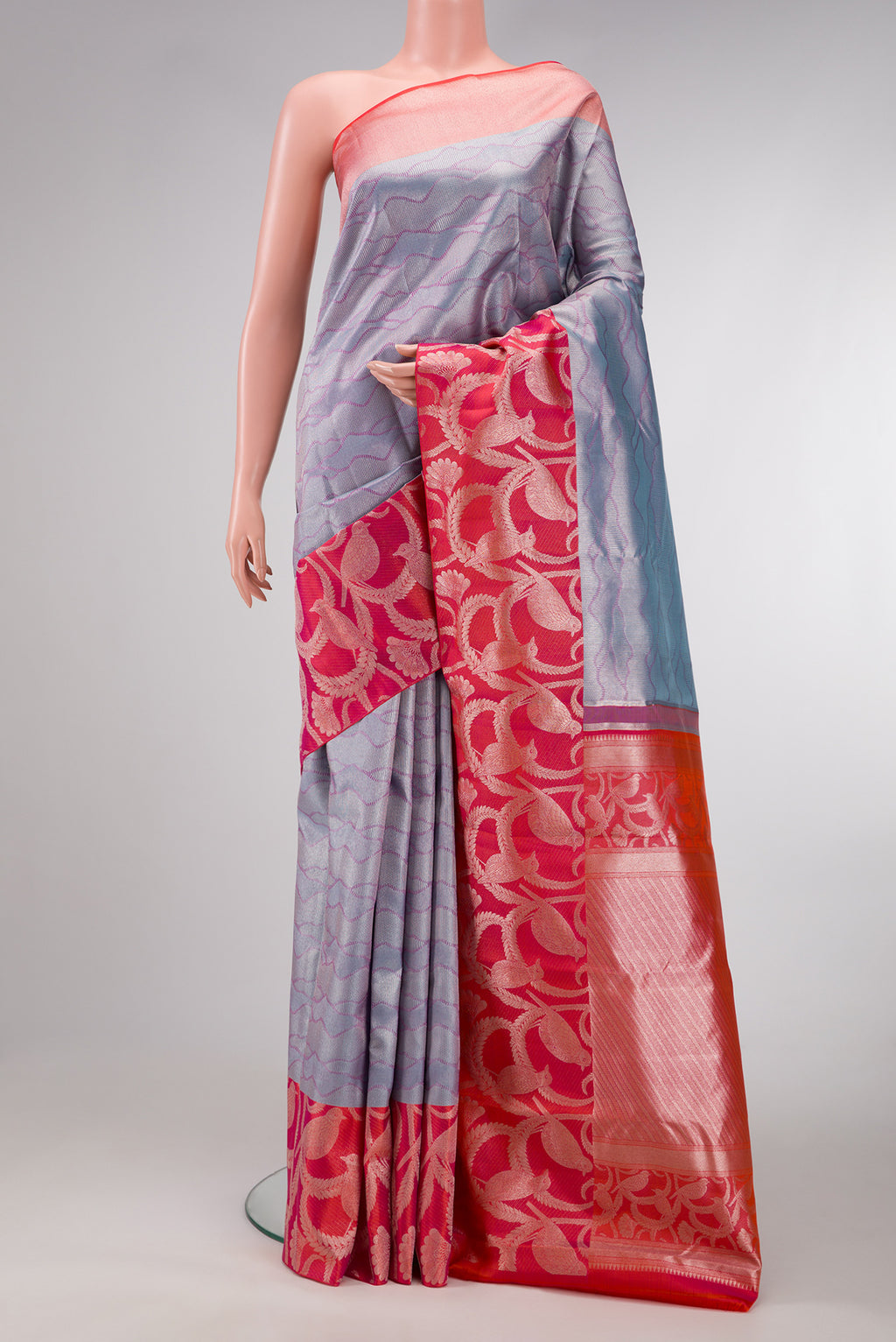 Grey Dual Tone Kanjivaram Tissue Silk Saree with Zari Brocade on the body and Fancy Border.  displayed on a mannequin
