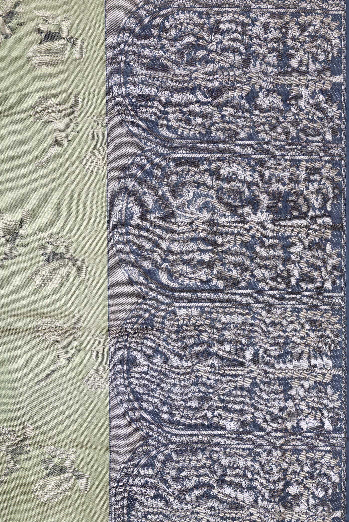 Border image of Sea Green Dual Tone Kanjivaram Tissue Silk Saree with Zari Brocade on the body and Fancy Border. 