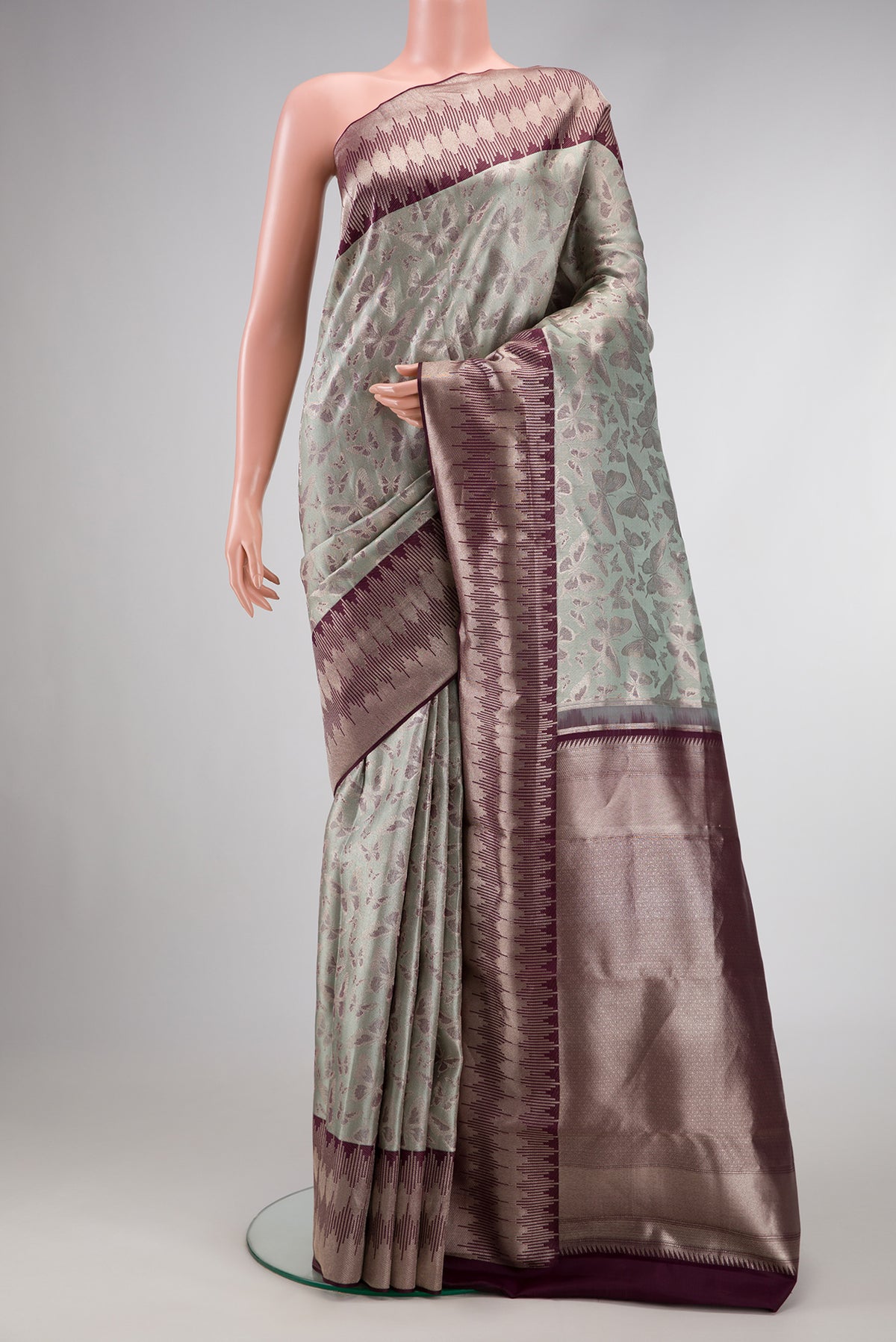 Light Green Dual Tone Kanjivaram Tissue Silk Saree with Zari Brocade on the body and Fancy Border.  displayed on a mannequin