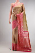 Gold Dual Tone Kanjivaram Tissue Silk Saree with Zari Brocade on the body and Fancy Border.  displayed on a mannequin