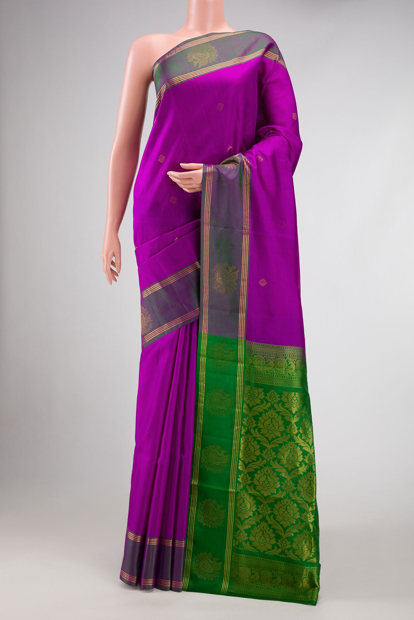 Purple Dual Tone Soft Silk Saree with Zari Butta on the body and Fancy Border.  displayed on a mannequin