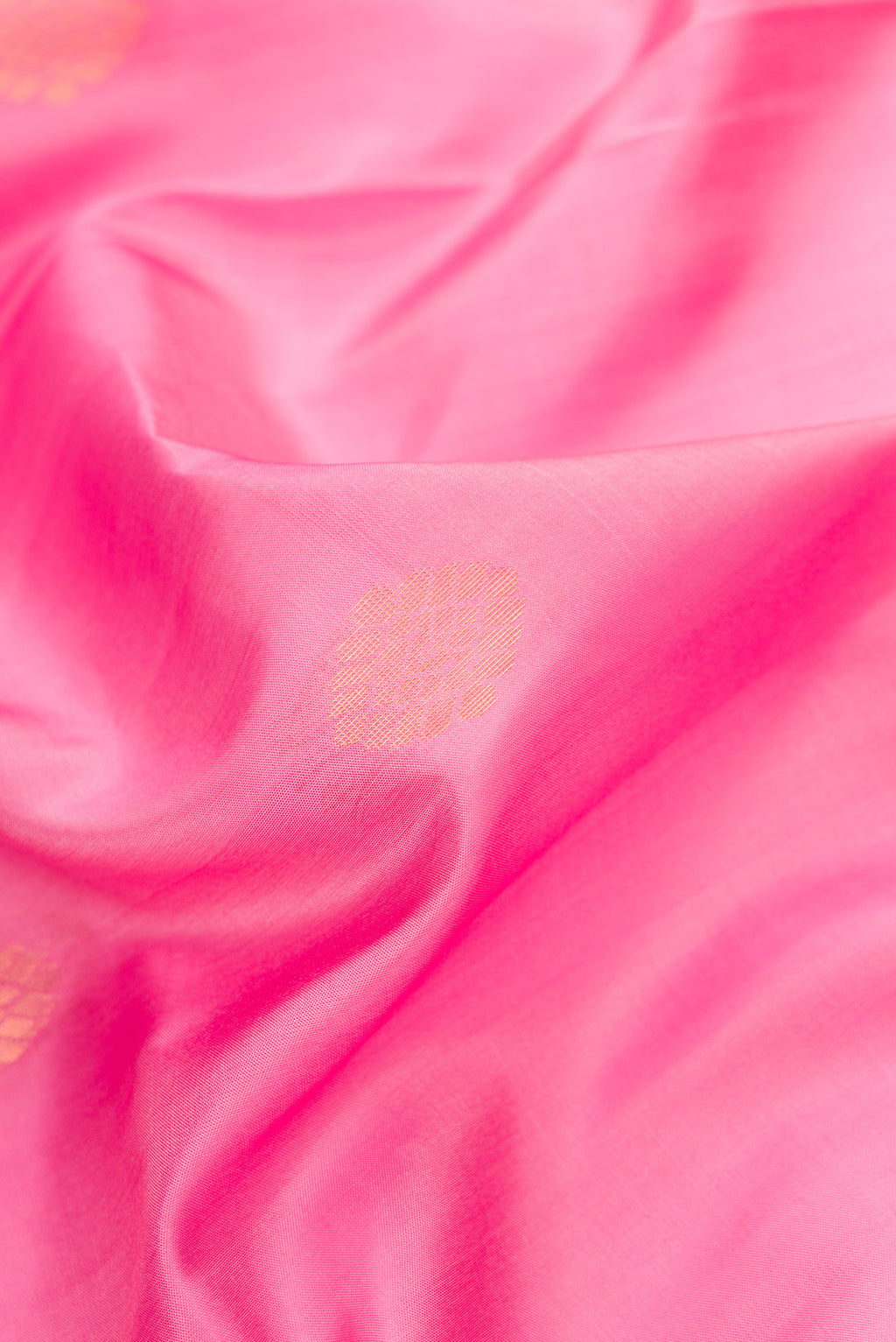 Close up of Pink Dual Tone Soft Silk Saree with Zari Butta on the body and Fancy Border.  displaying folds