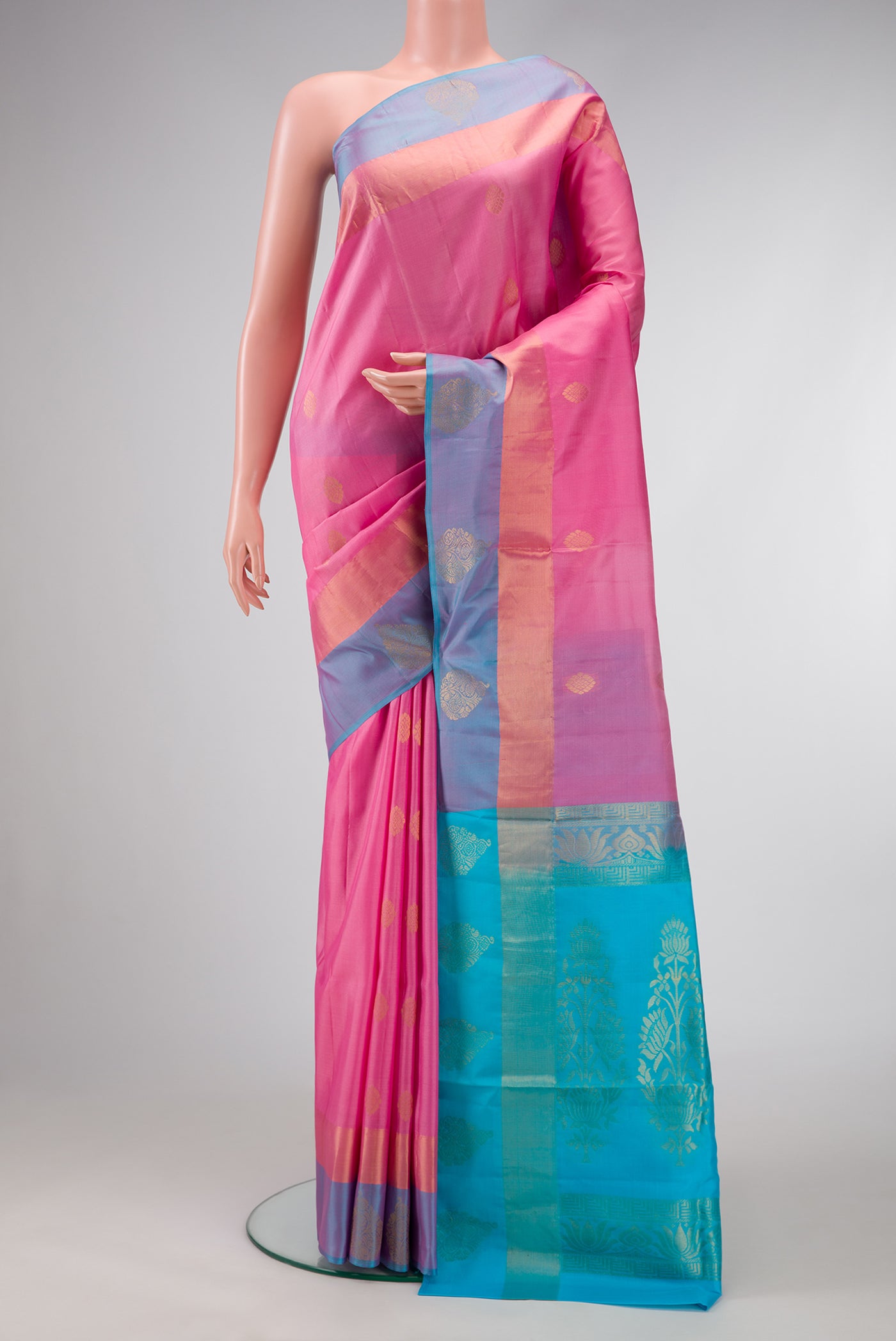 Pink Dual Tone Soft Silk Saree with Zari Butta on the body and Fancy Border.  displayed on a mannequin