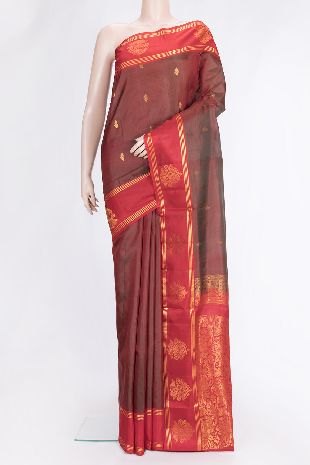 Maroon Dual Tone Soft Silk Saree with Zari Butta on the body and Fancy Border.  displayed on a mannequin