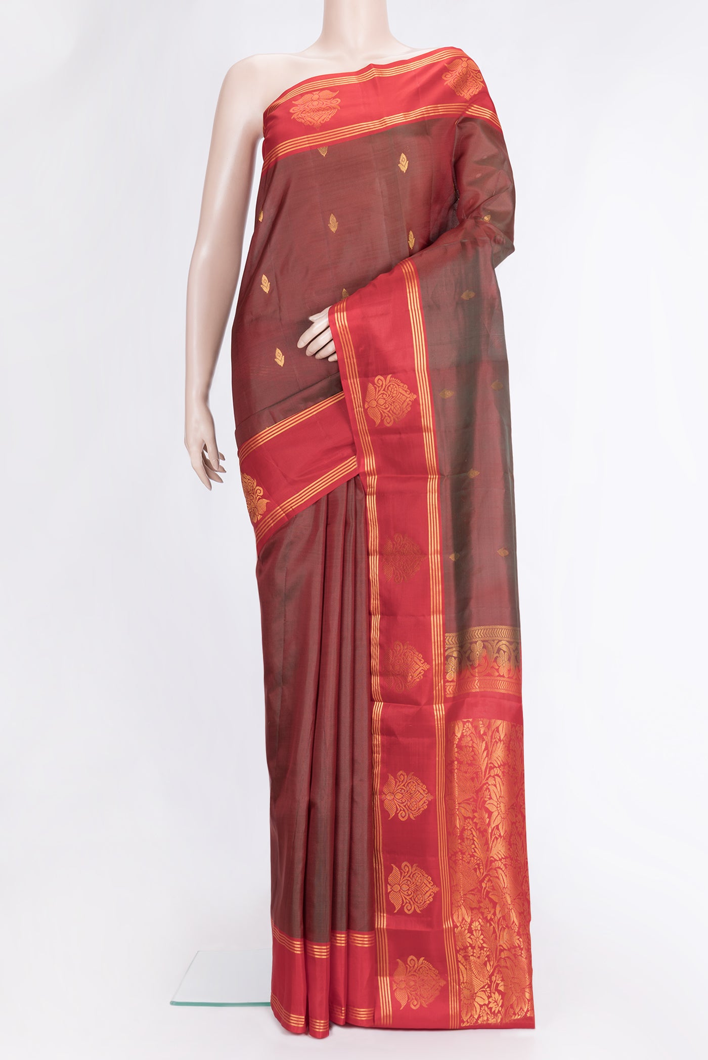 Maroon Dual Tone Soft Silk Saree with Zari Butta on the body and Fancy Border.  displayed on a mannequin