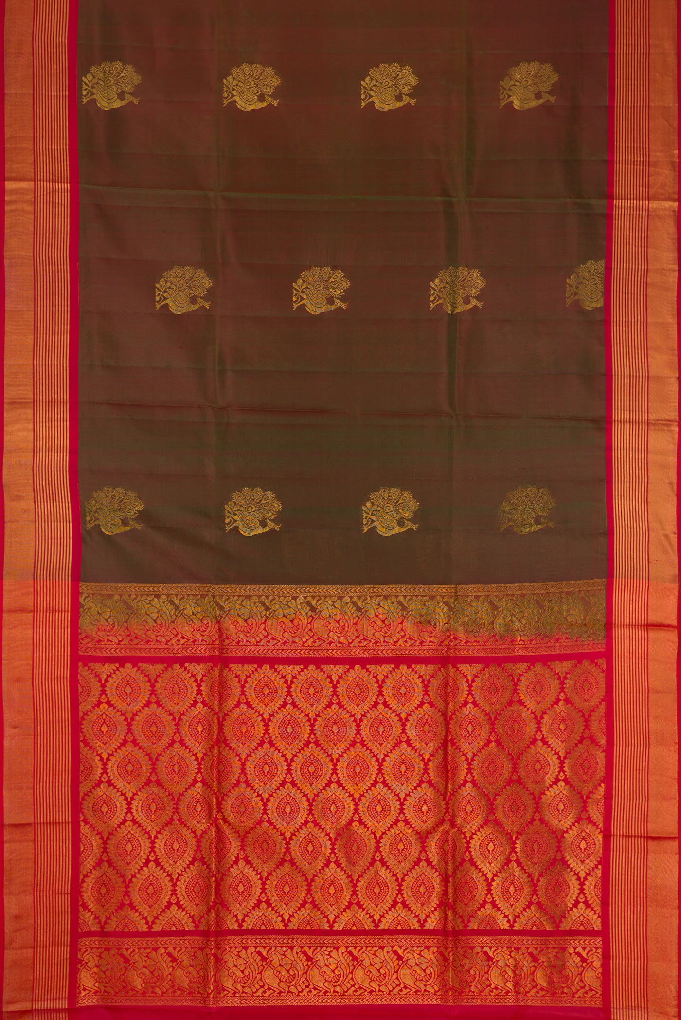Bottle Green Dual Tone Soft Silk Saree with Zari Butta on the body and Zari Border.  displayed on a mannequin