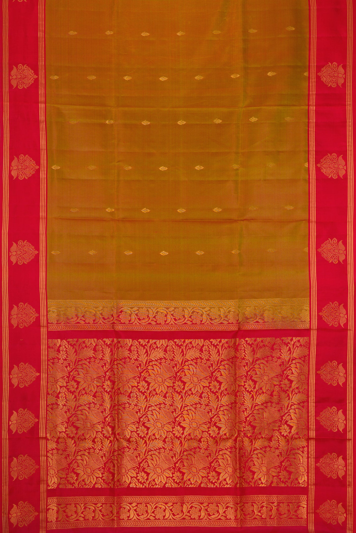 Mustard Dual Tone Soft Silk Saree with Zari Butta on the body and Fancy Border.  displayed on a mannequin