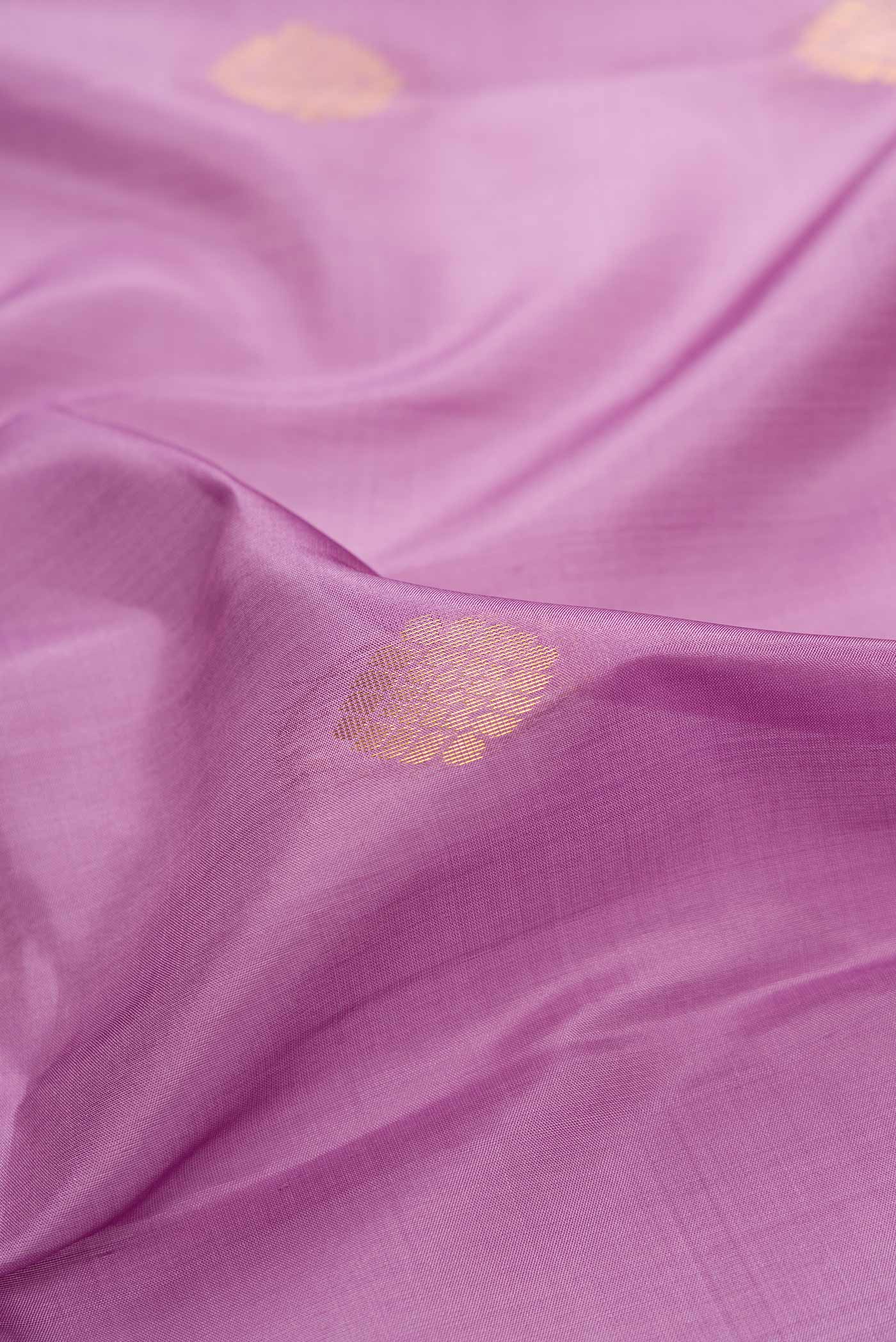 Close up of Purple Dual Tone Soft Silk Saree with Zari Butta on the body and Fancy Border.  displaying folds