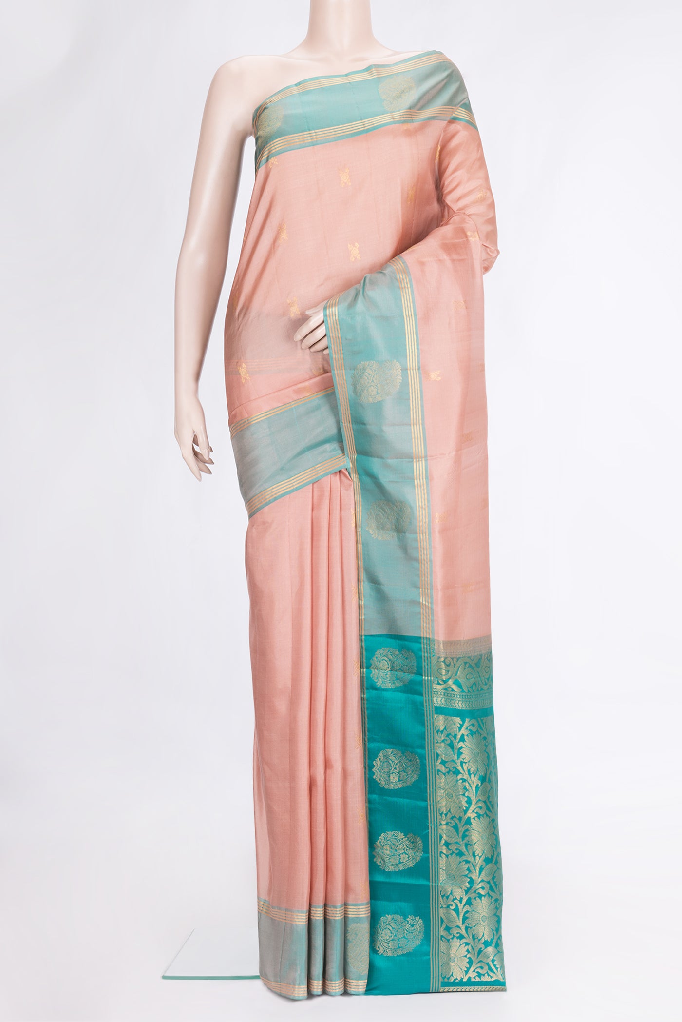 Peach Dual Tone Soft Silk Saree with Zari Butta on the body and Fancy Border.  displayed on a mannequin