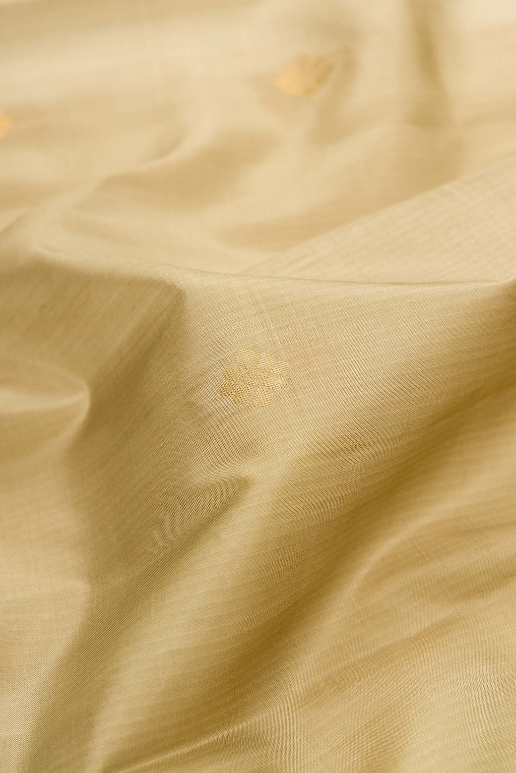 Close up of Mehandi Green Dual Tone Soft Silk Saree with Zari Butta on the body and Fancy Border.  displaying folds