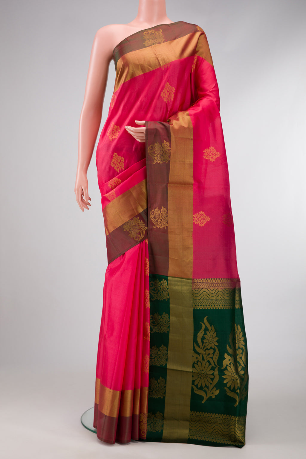 Pink Dual Tone Soft Silk Saree with Zari Butta on the body and Fancy Border.  displayed on a mannequin