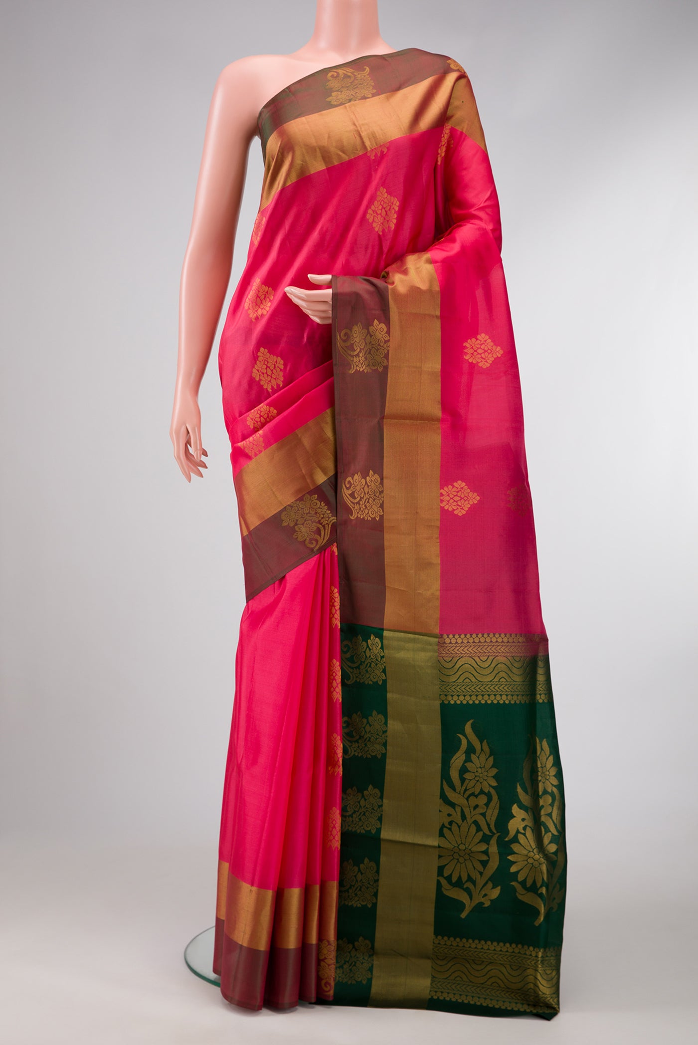 Pink Dual Tone Soft Silk Saree with Zari Butta on the body and Fancy Border.  displayed on a mannequin